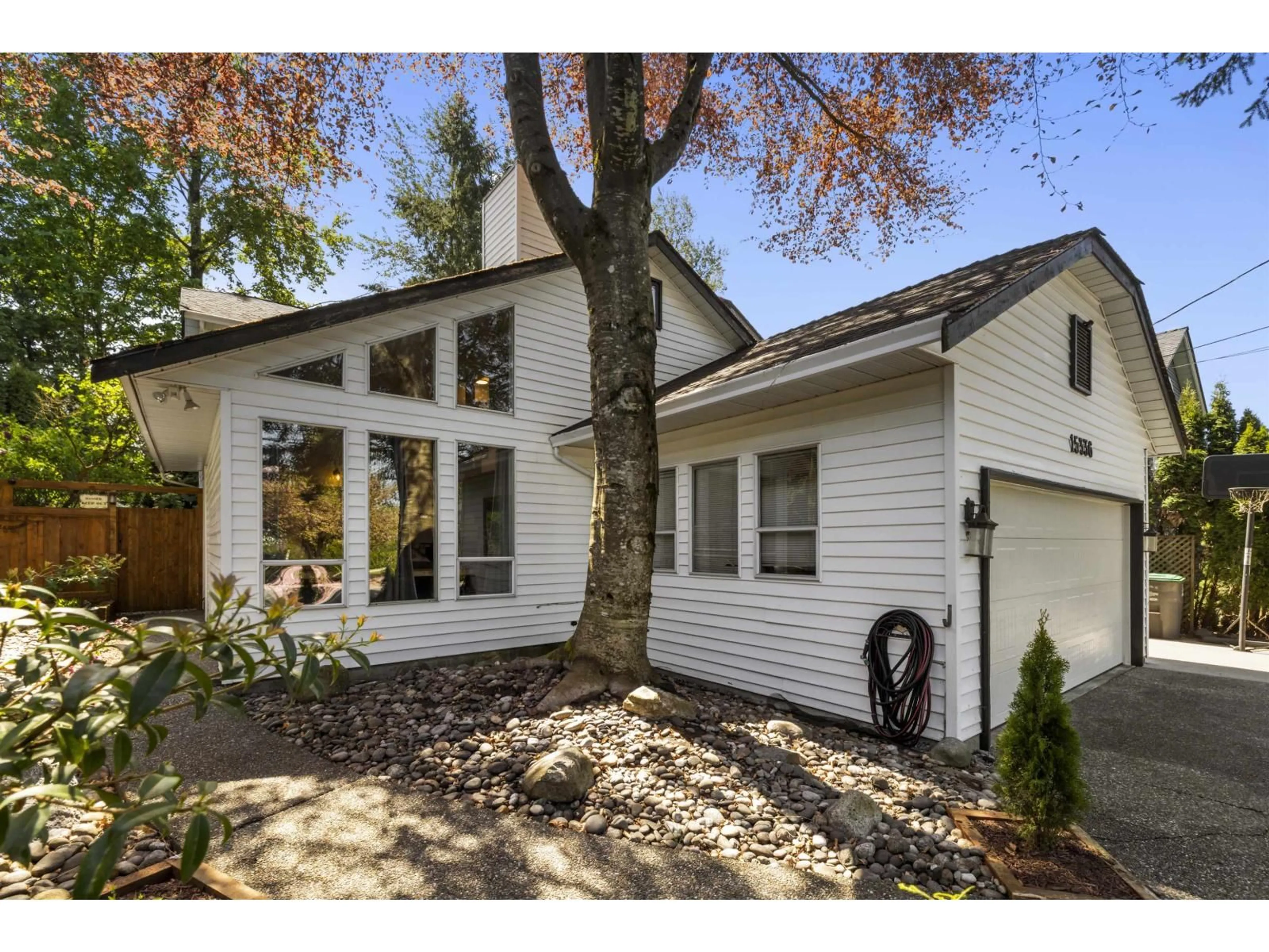 Home with vinyl exterior material, street for 15336 112 AVENUE, Surrey British Columbia V3R8Y8