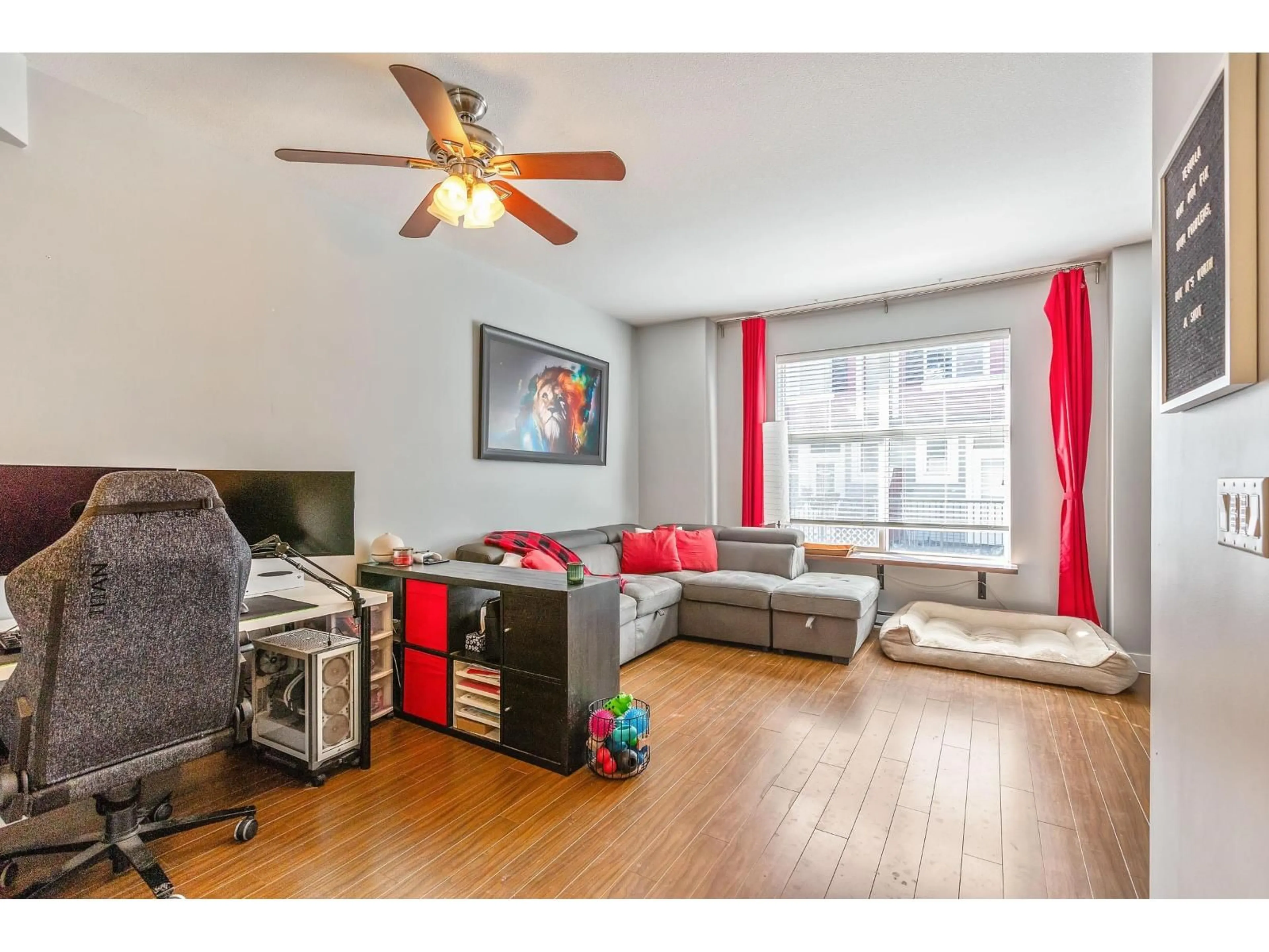 Living room with furniture, wood/laminate floor for 19 - 18211 70 AVENUE, Surrey British Columbia V3S8K9
