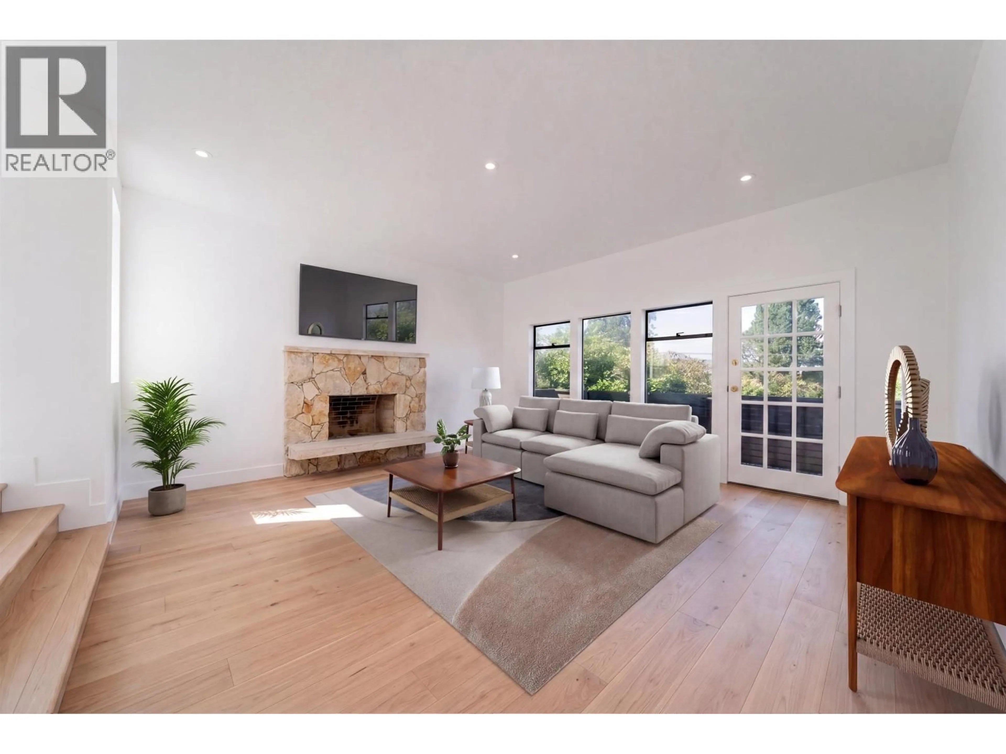 Living room with furniture, wood/laminate floor for 3974 10TH AVENUE, Vancouver British Columbia V6R2G8