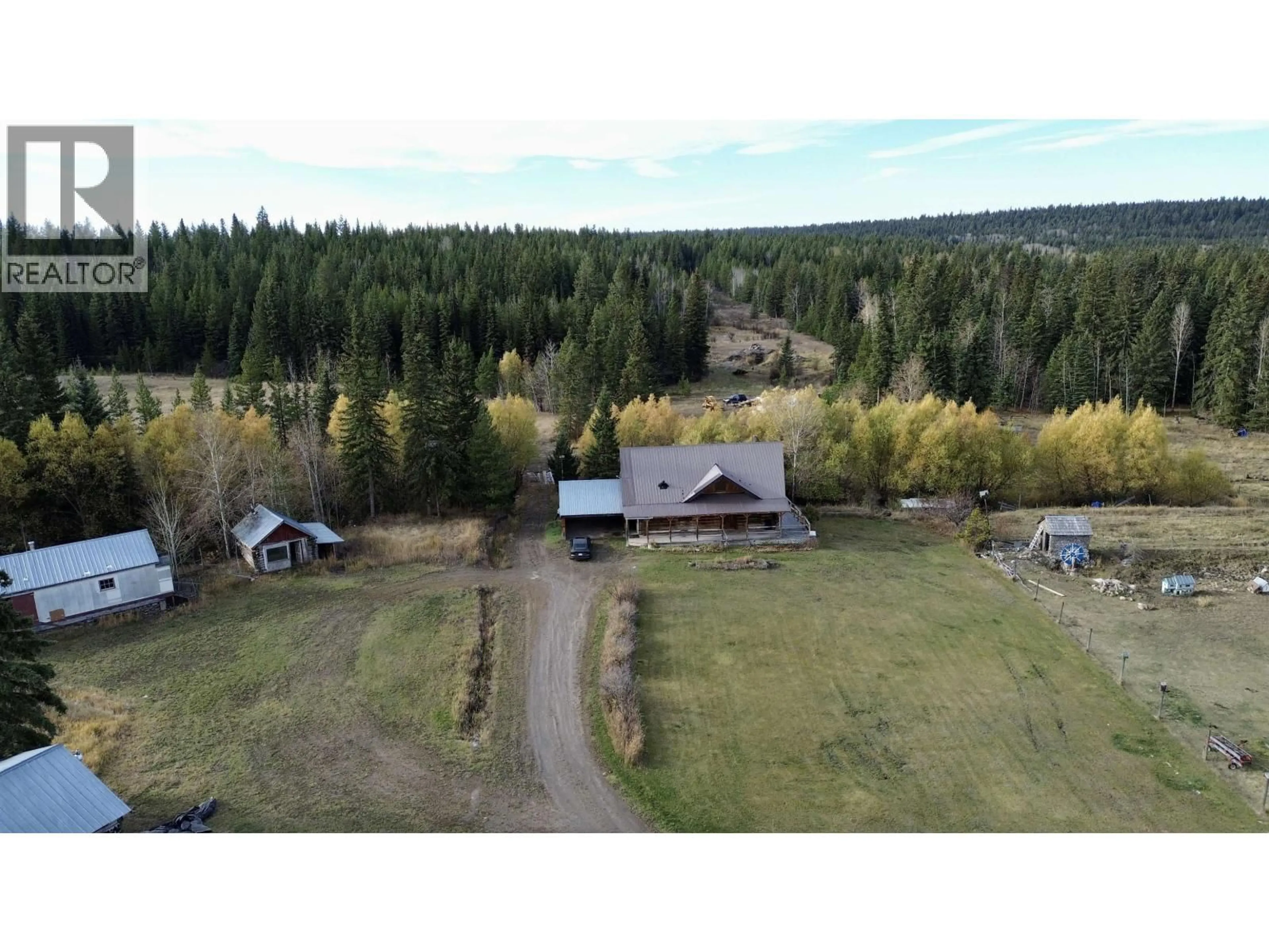 A pic from outside/outdoor area/front of a property/back of a property/a pic from drone, forest/trees view for 3642 SPOKIN LAKE ROAD, 150 Mile House British Columbia V0K2G0