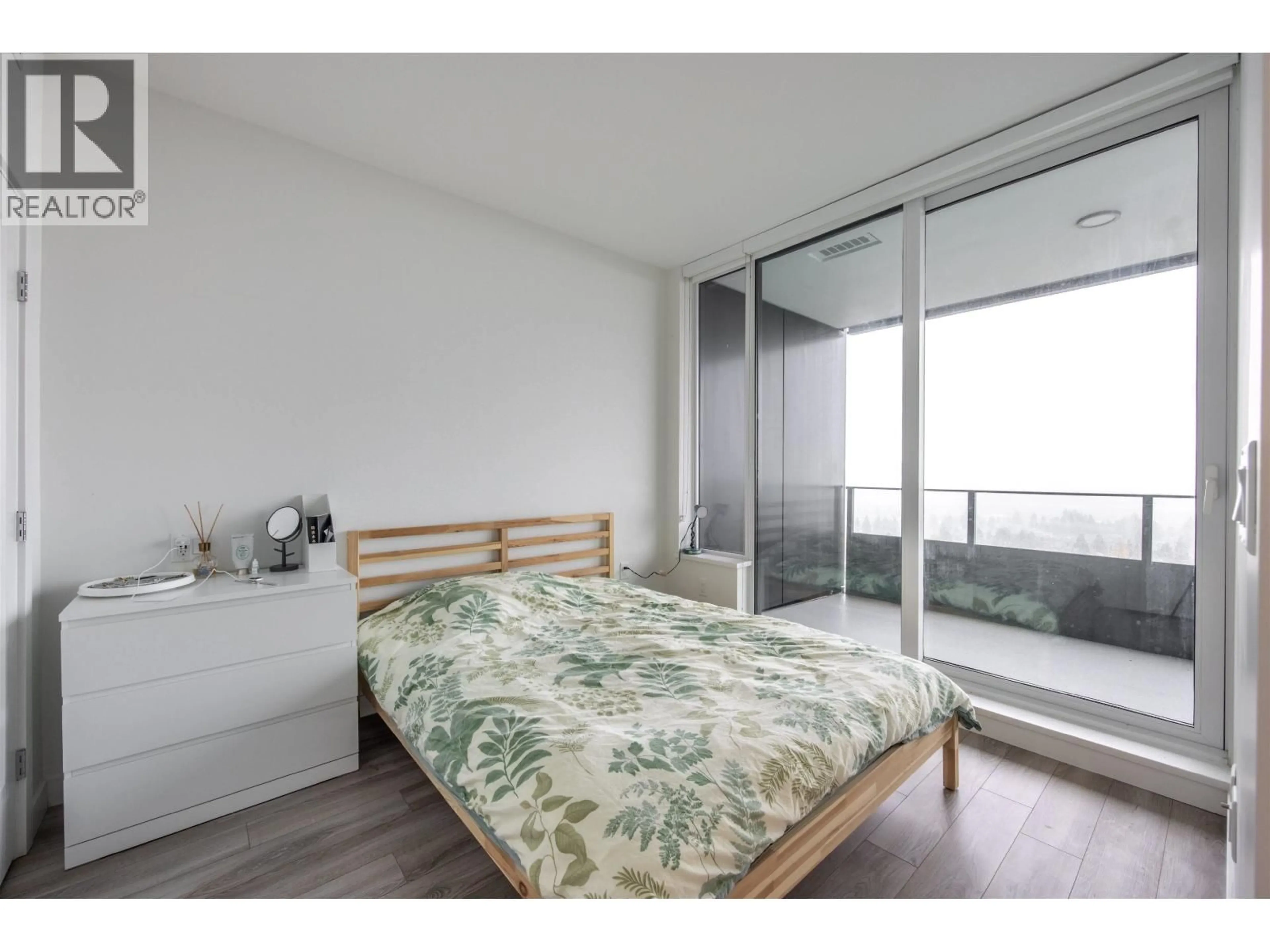 Bedroom with bed, wood/laminate floor for 2108 - 6699 DUNBLANE AVENUE, Burnaby British Columbia V5H0J8