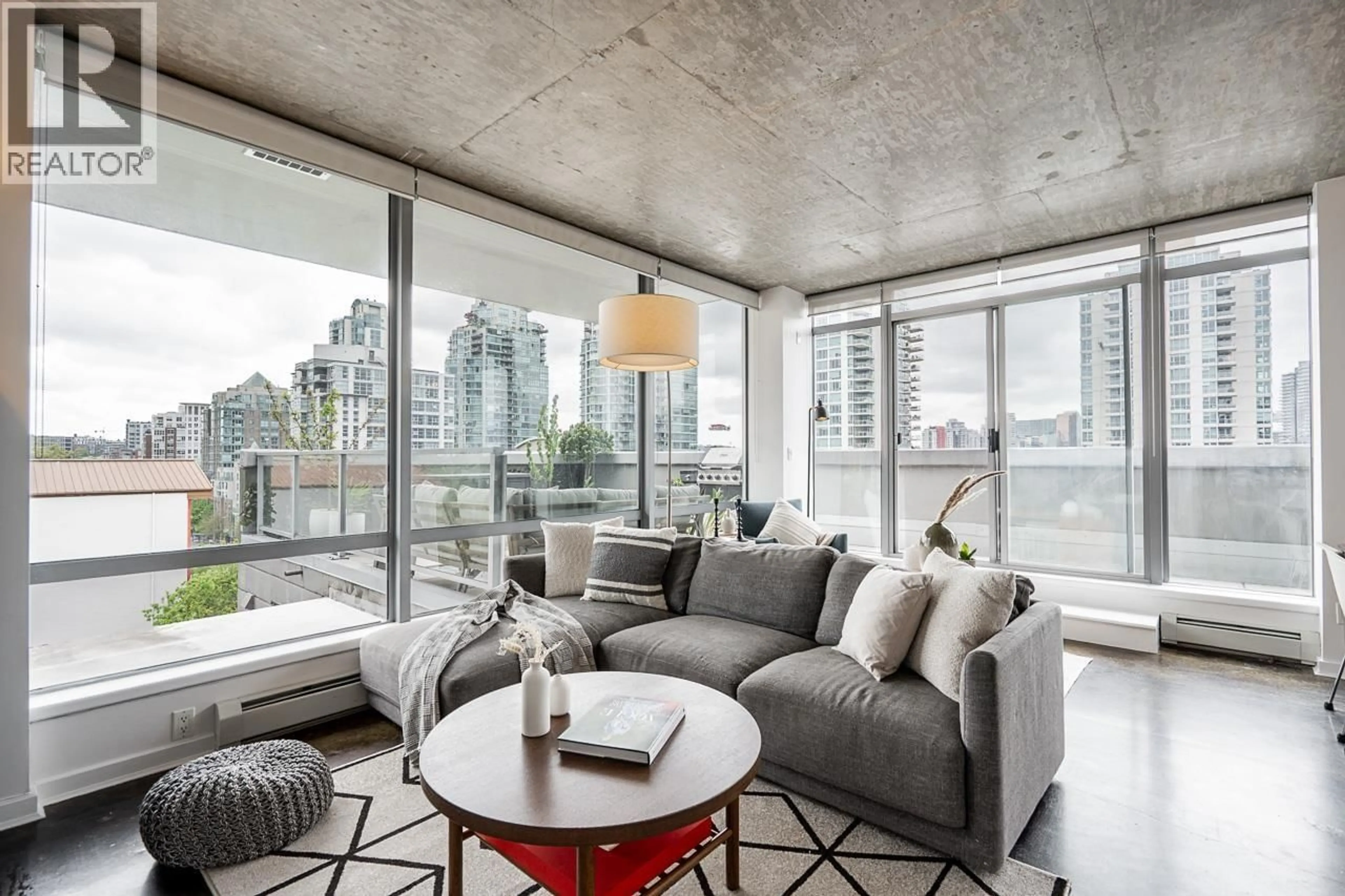 Living room with furniture, cement floor for 804 - 919 STATION STREET, Vancouver British Columbia V6A4L9