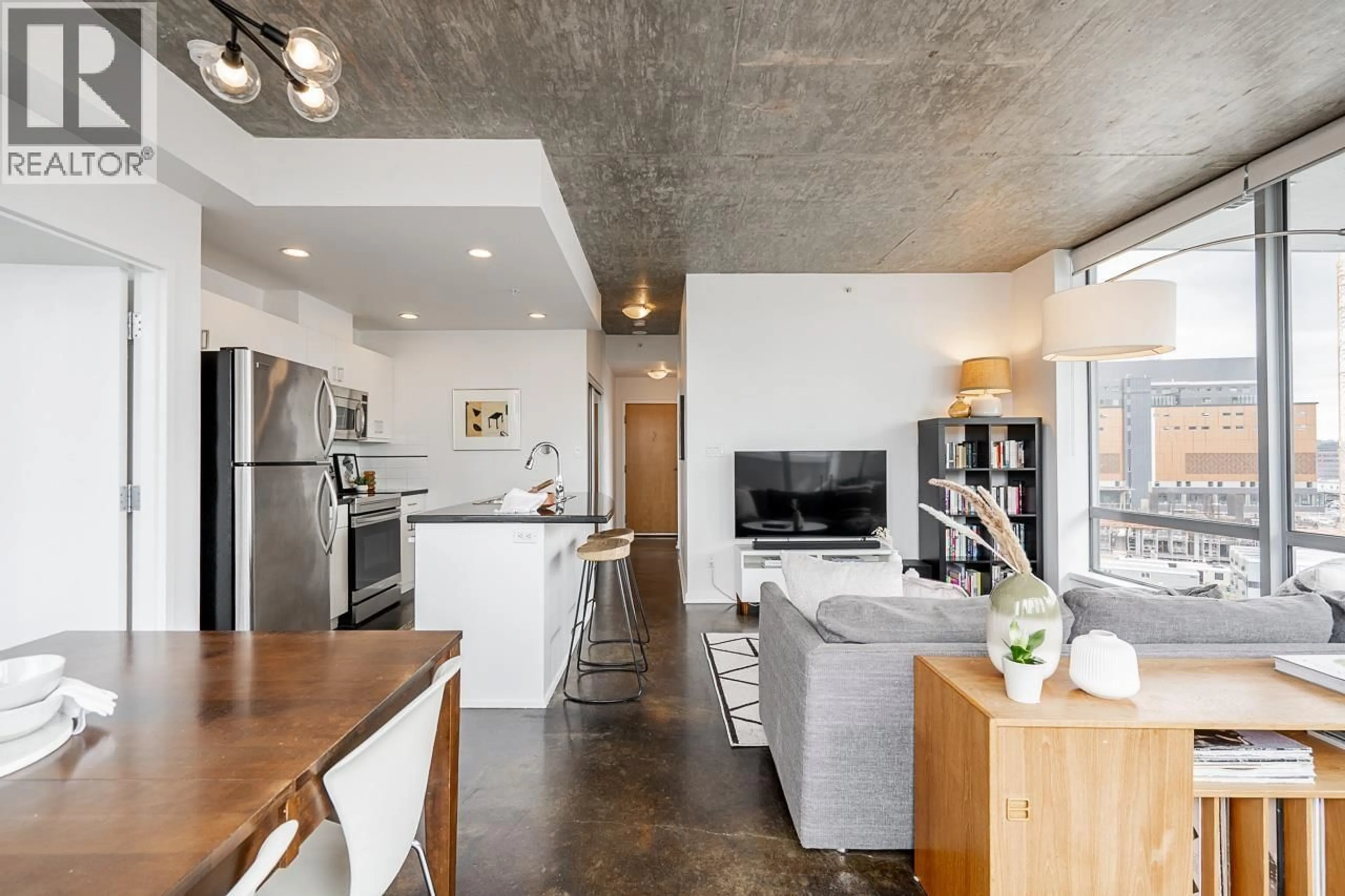 Open concept kitchen, cement floor for 804 - 919 STATION STREET, Vancouver British Columbia V6A4L9