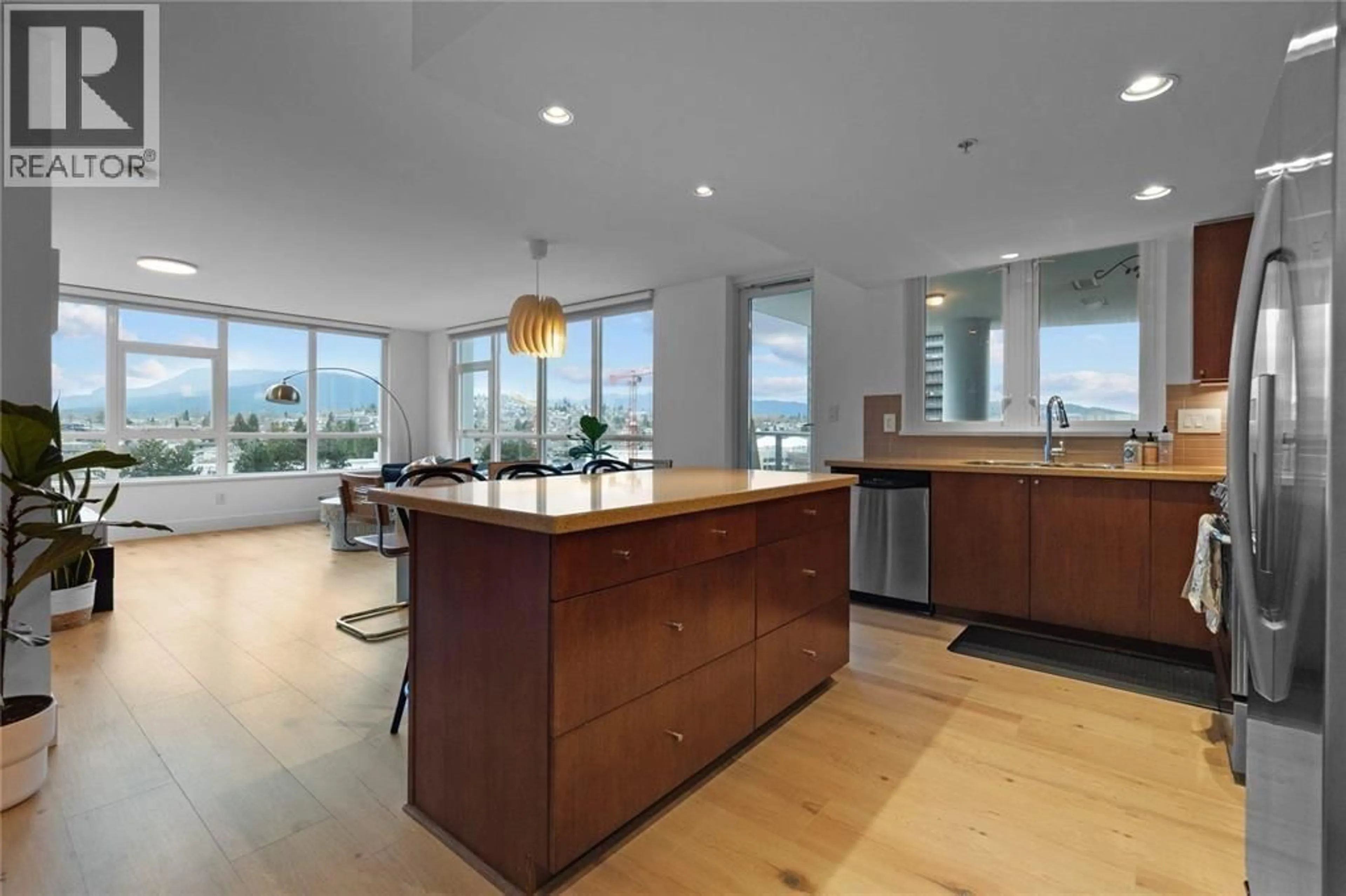 Open concept kitchen, wood/laminate floor for 1102 - 4400 BUCHANAN STREET, Burnaby British Columbia V5C0E3