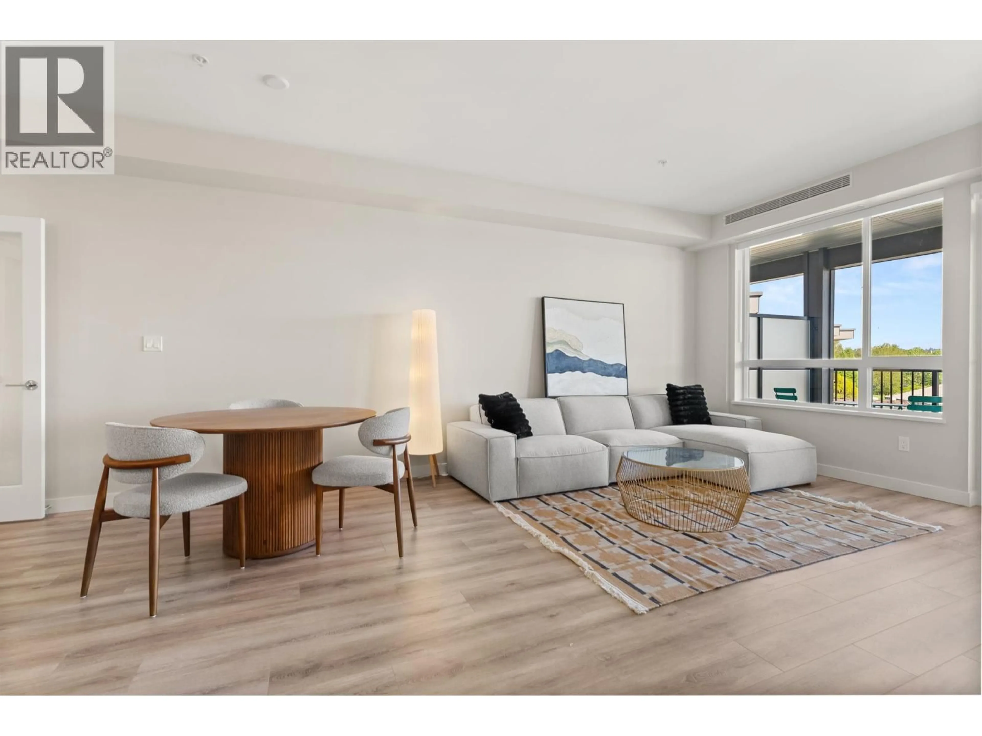 Living room with furniture, wood/laminate floor for 513 - 23222 GILLEY ROAD, Richmond British Columbia V6V0C8