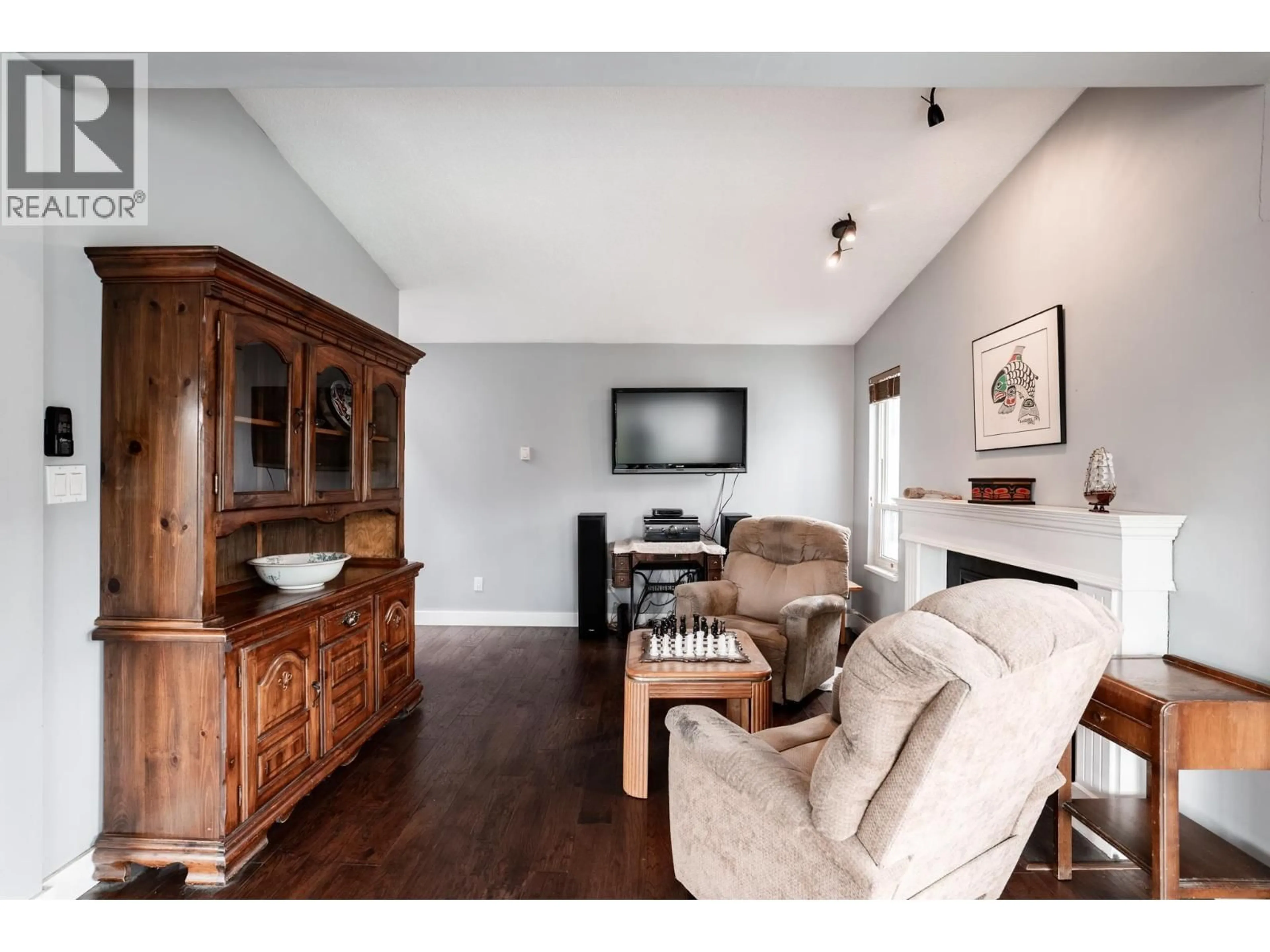 Living room with furniture, wood/laminate floor for 303 - 2615 LONSDALE AVENUE, North Vancouver British Columbia V7N3H7