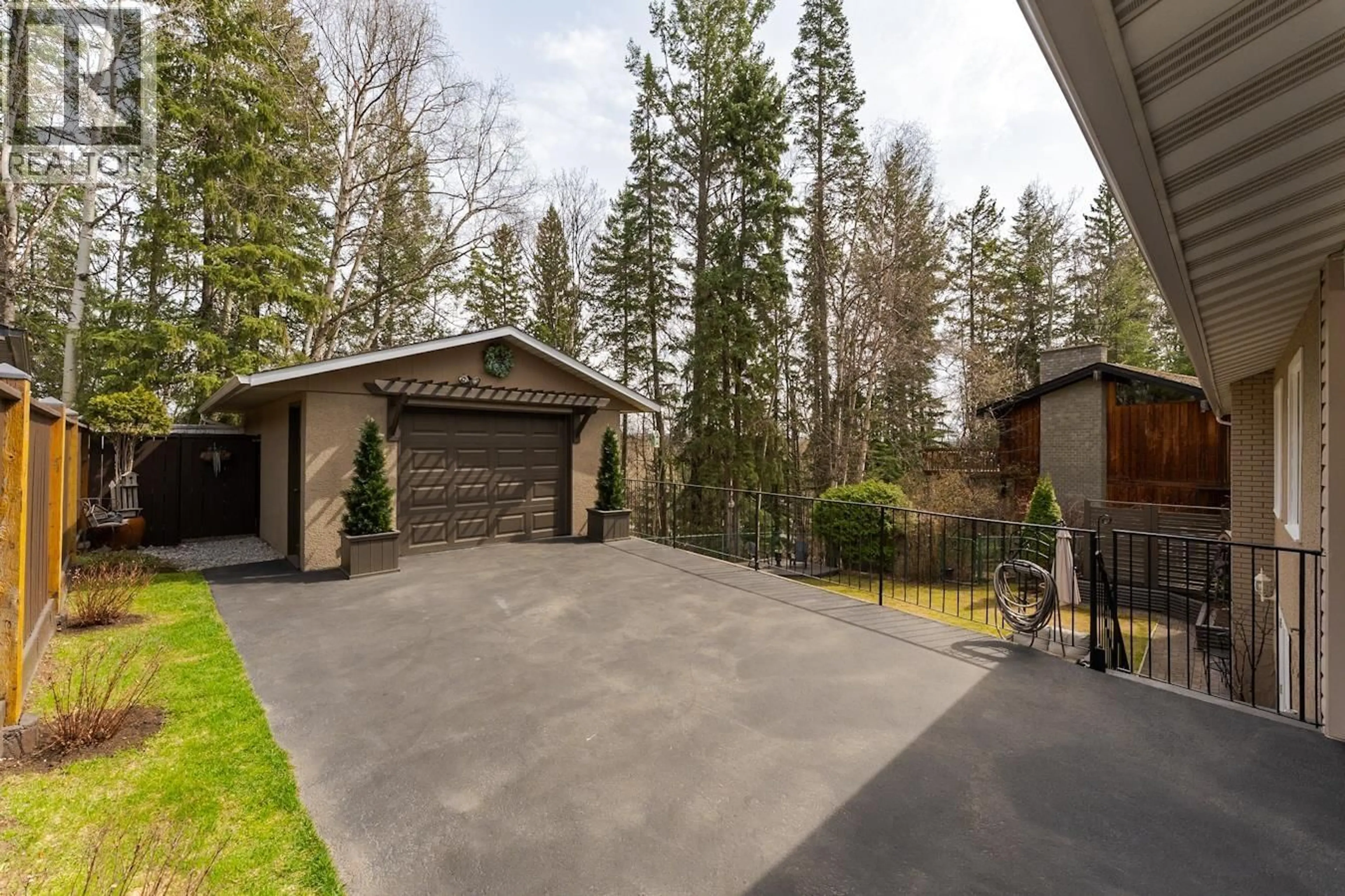 A pic from outside/outdoor area/front of a property/back of a property/a pic from drone, forest/trees view for 5522 DALHOUSIE DRIVE, Prince George British Columbia V2N1Z9