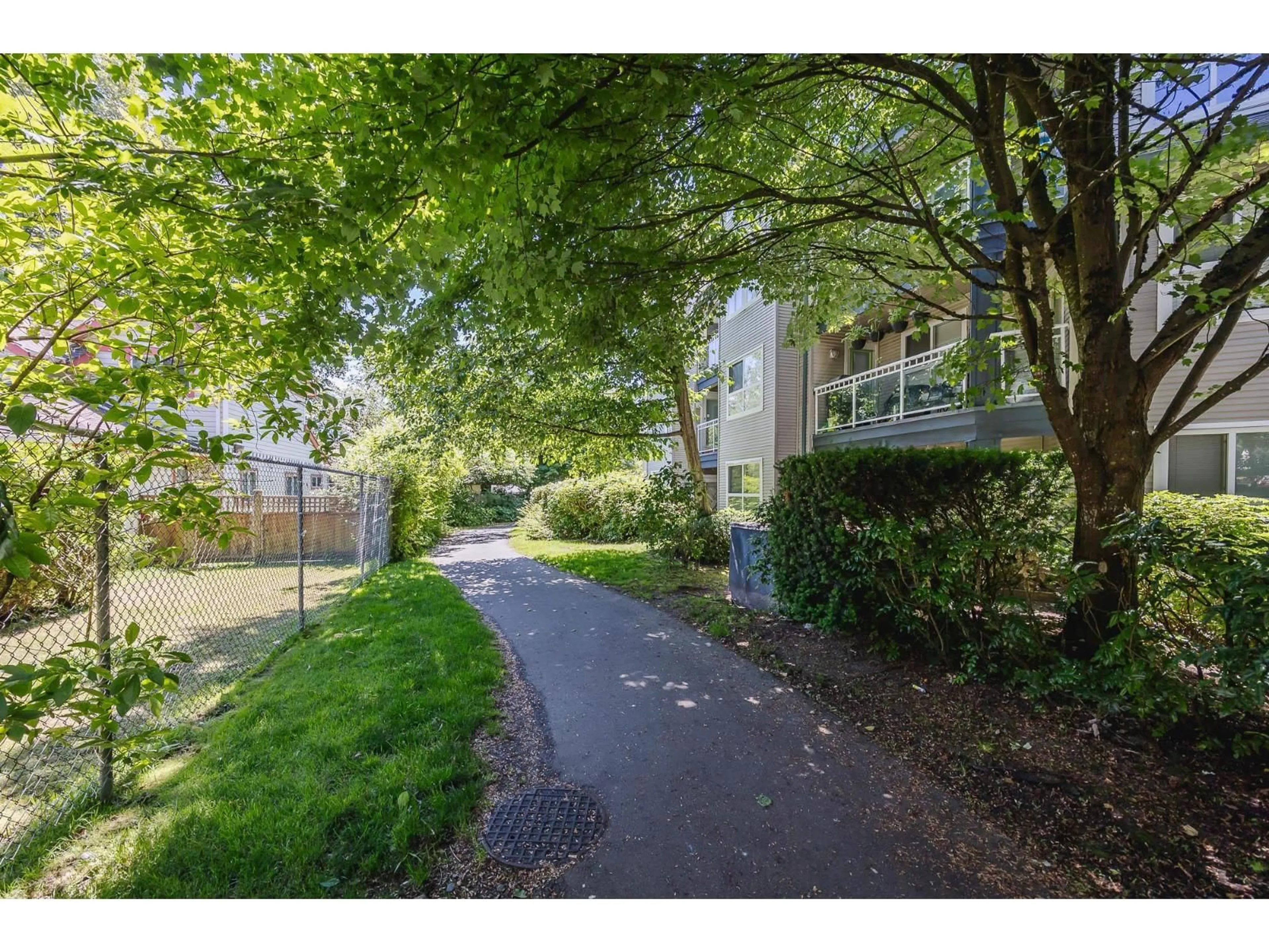 A pic from outside/outdoor area/front of a property/back of a property/a pic from drone, street for 202 - 8115 121A STREET, Surrey British Columbia V3W1J2