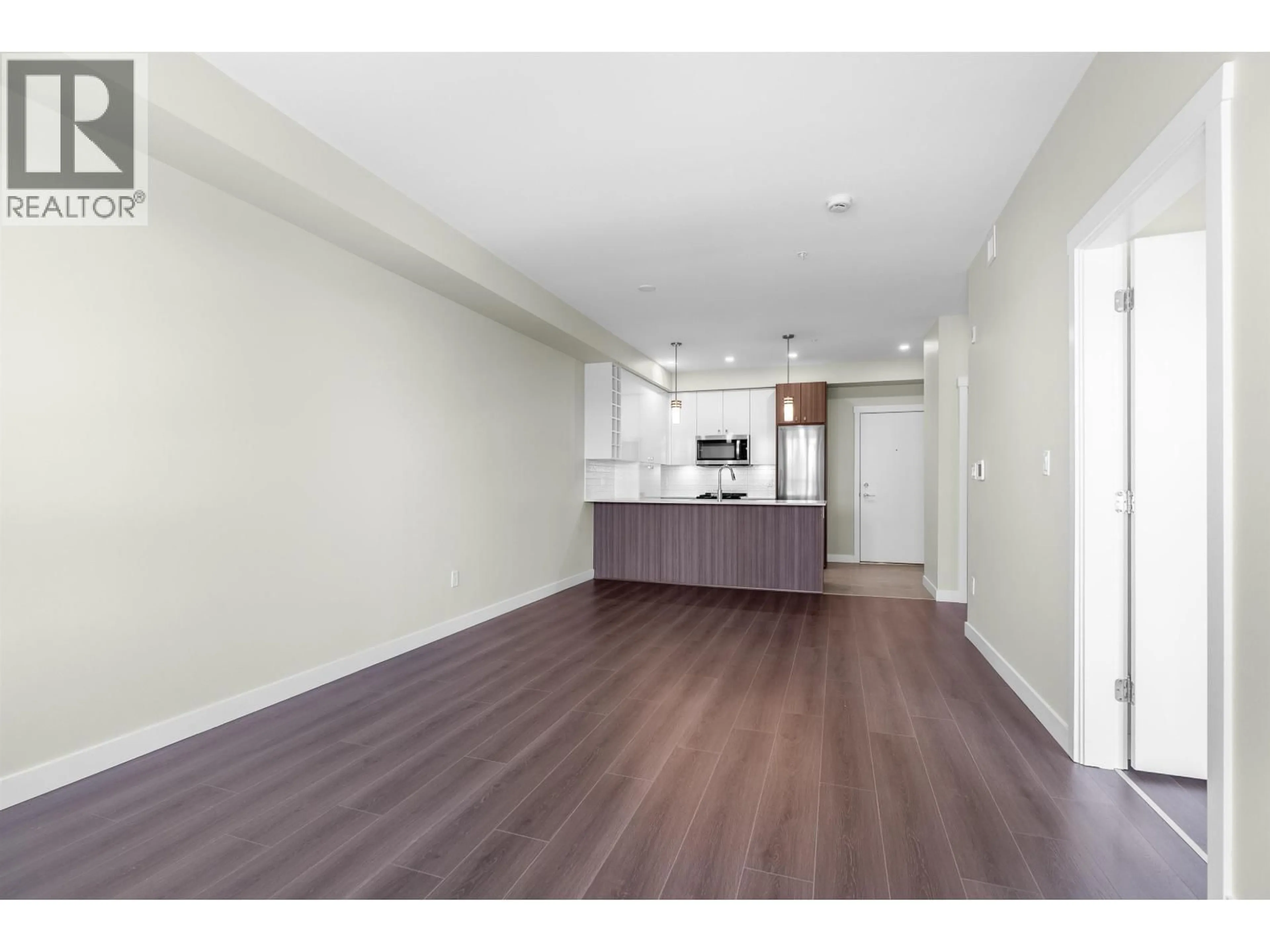 Open concept kitchen, wood/laminate floor for 316 - 23200 GILLEY ROAD, Richmond British Columbia V6V0C7