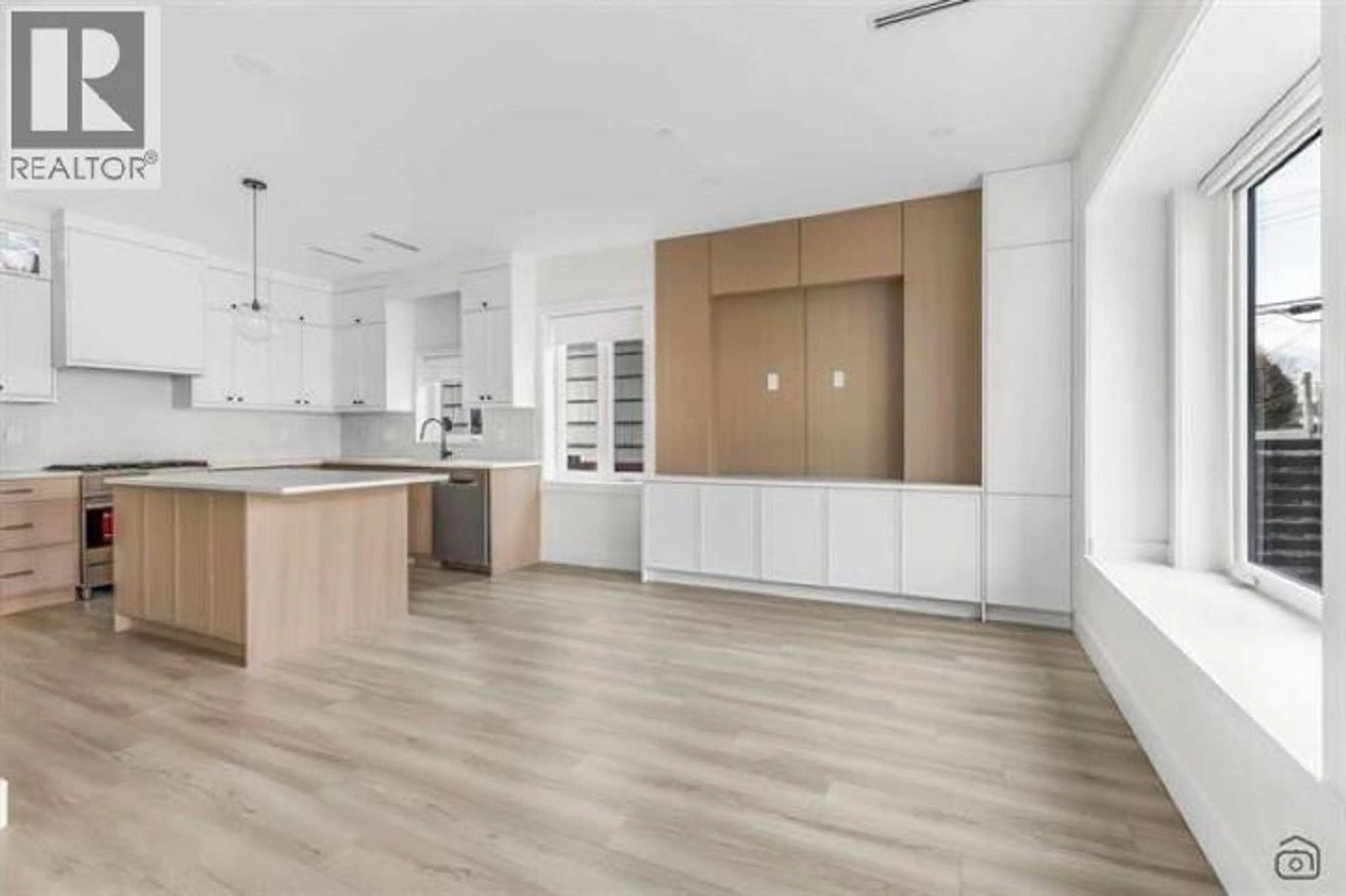 Open concept kitchen, wood/laminate floor for 718 62ND AVENUE, Vancouver British Columbia V5X2G5