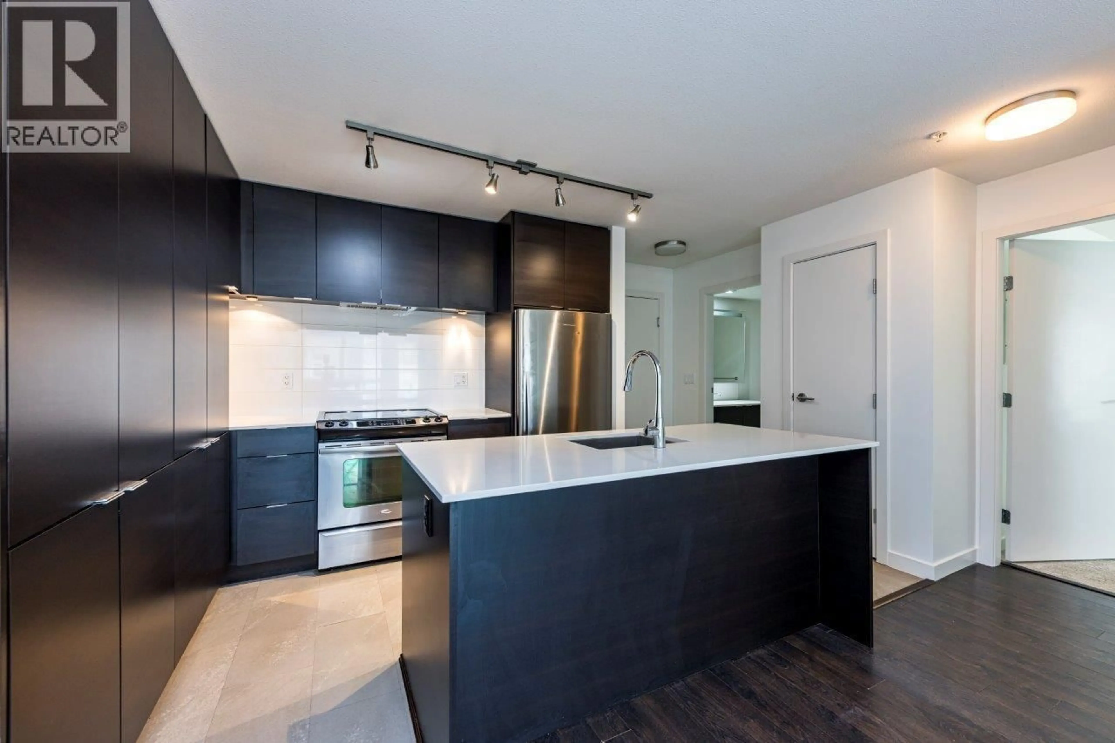 Open concept kitchen, unknown for 302 - 1677 LLOYD AVENUE, North Vancouver British Columbia V7P0B1