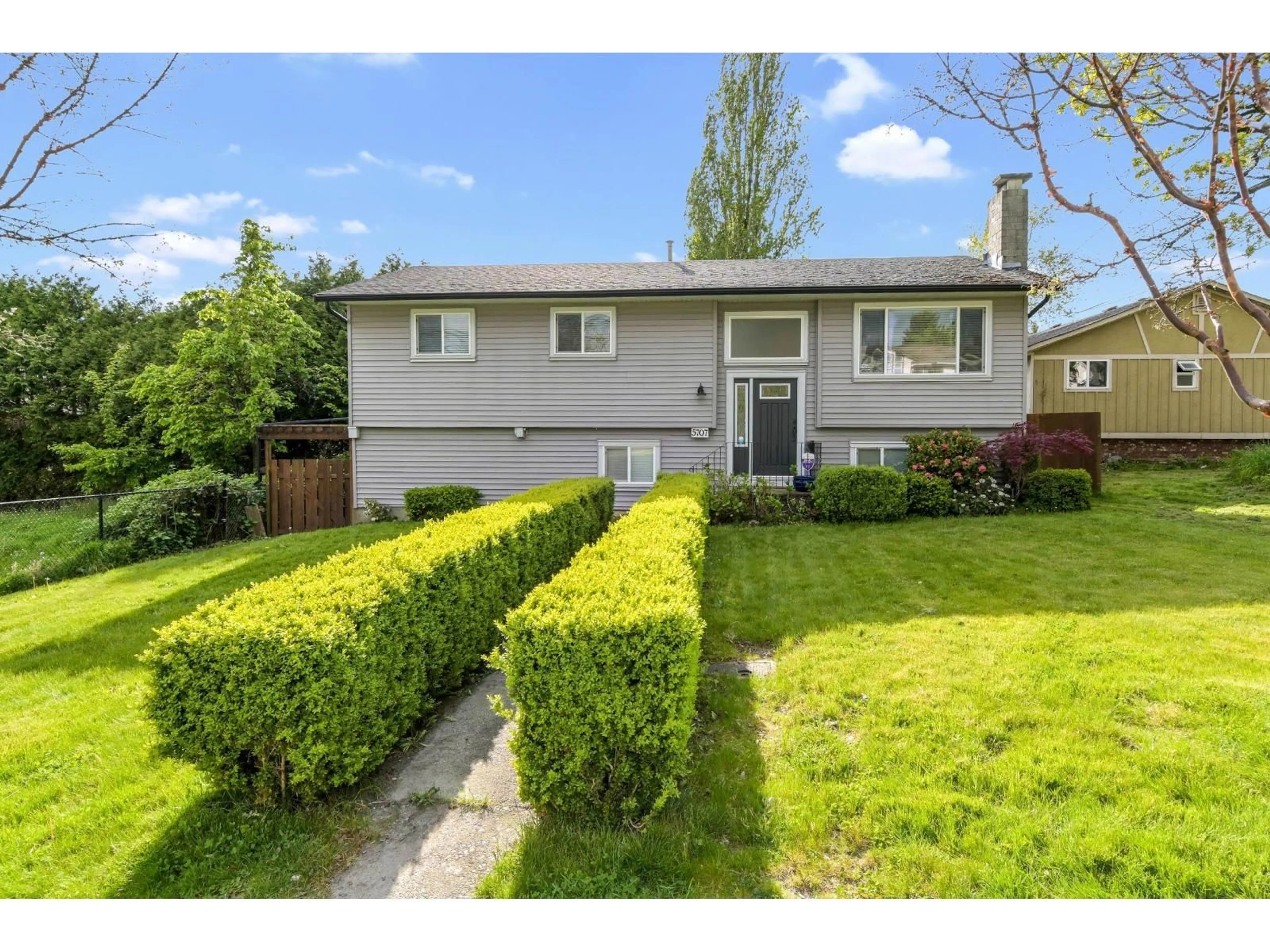 Home with vinyl exterior material, street for 5707 184 STREET, Surrey British Columbia V3S4N1