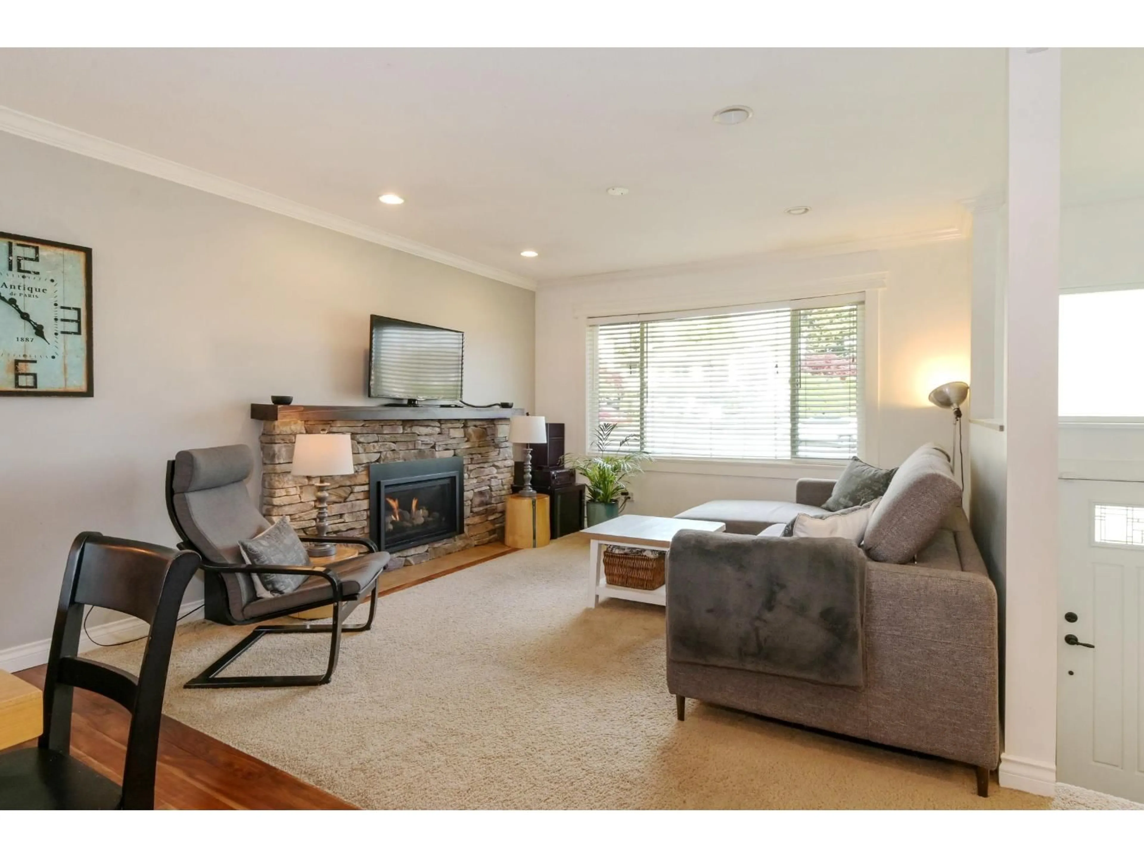 Living room with furniture, wood/laminate floor for 5707 184 STREET, Surrey British Columbia V3S4N1