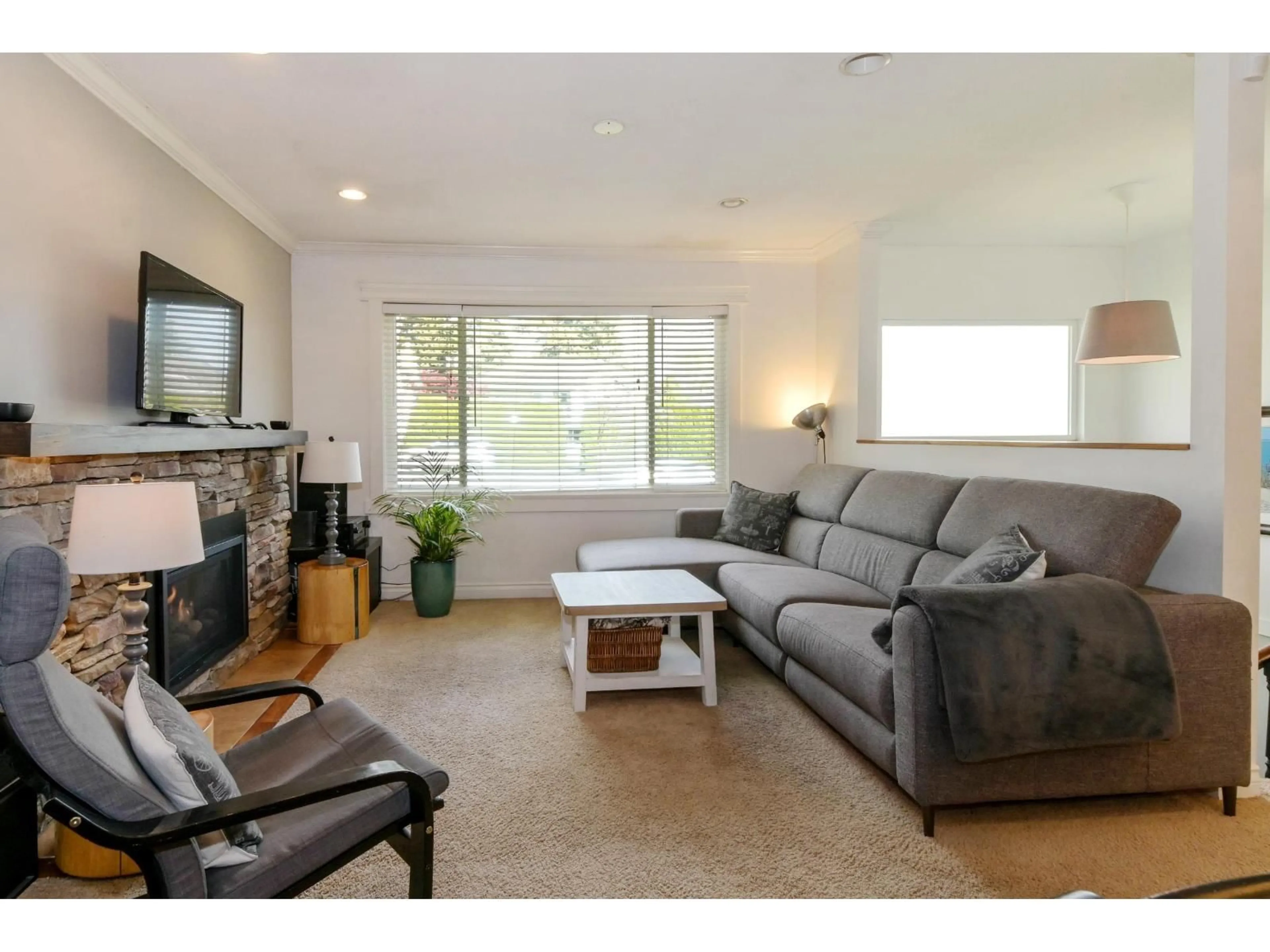 Living room with furniture, wood/laminate floor for 5707 184 STREET, Surrey British Columbia V3S4N1