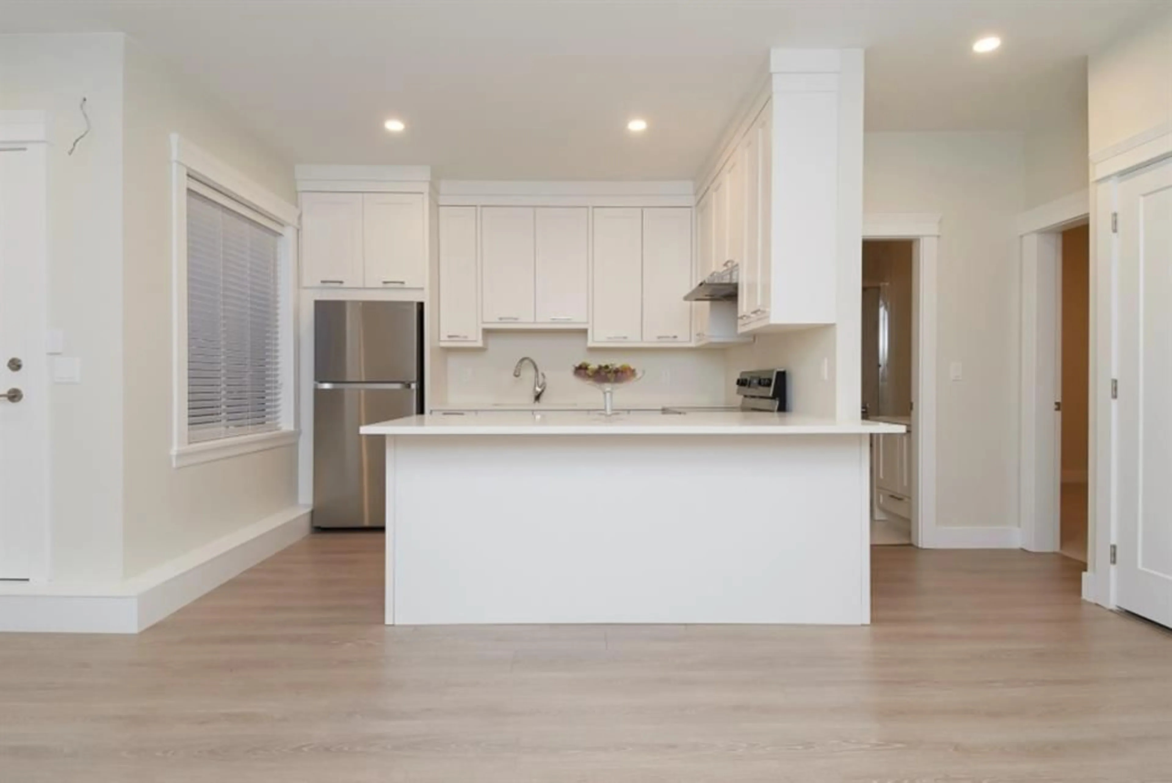 Open concept kitchen, wood/laminate floor for 2751 164 STREET, Surrey British Columbia V3Z0E2