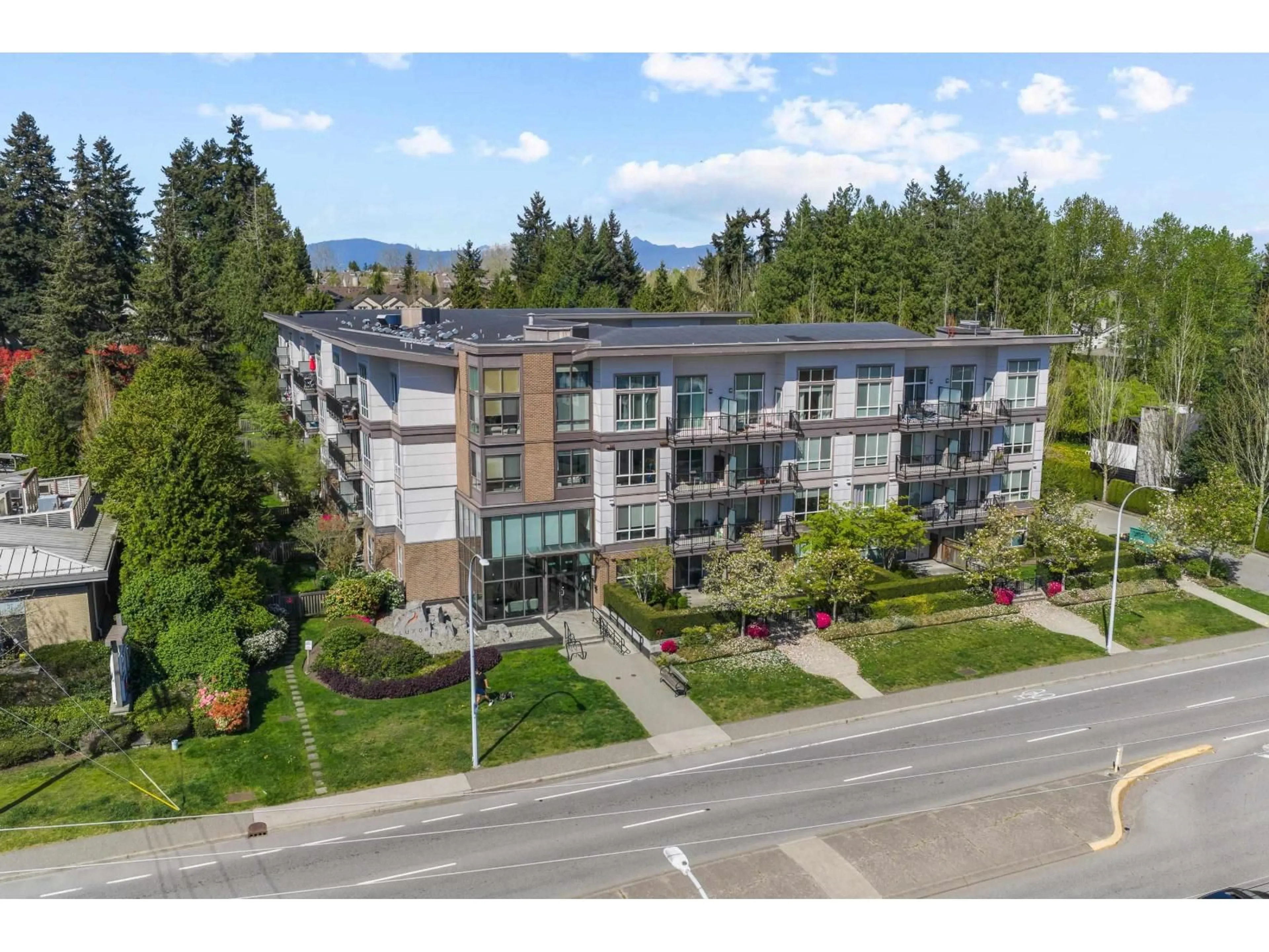A pic from outside/outdoor area/front of a property/back of a property/a pic from drone, mountain view for 413 - 12039 64 AVENUE, Surrey British Columbia V3W0R7