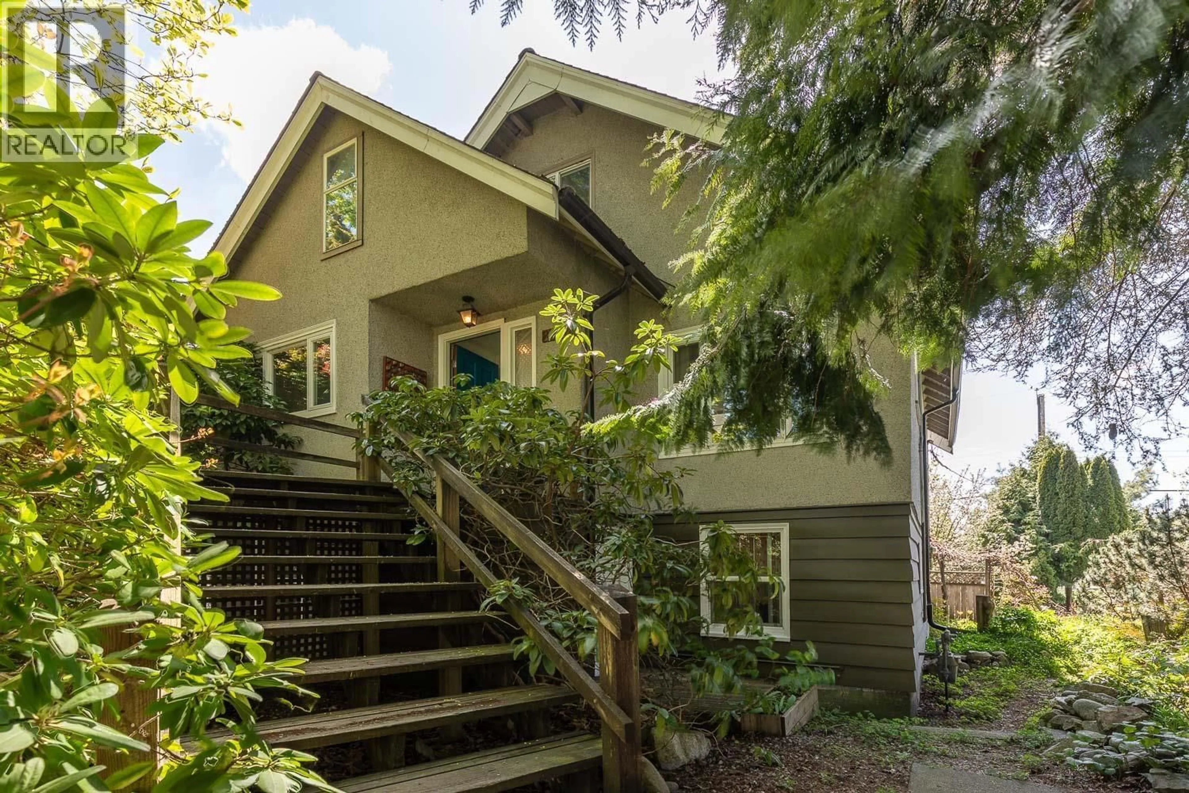 Home with vinyl exterior material, street for 2002 13TH AVENUE, Vancouver British Columbia V5N2C4