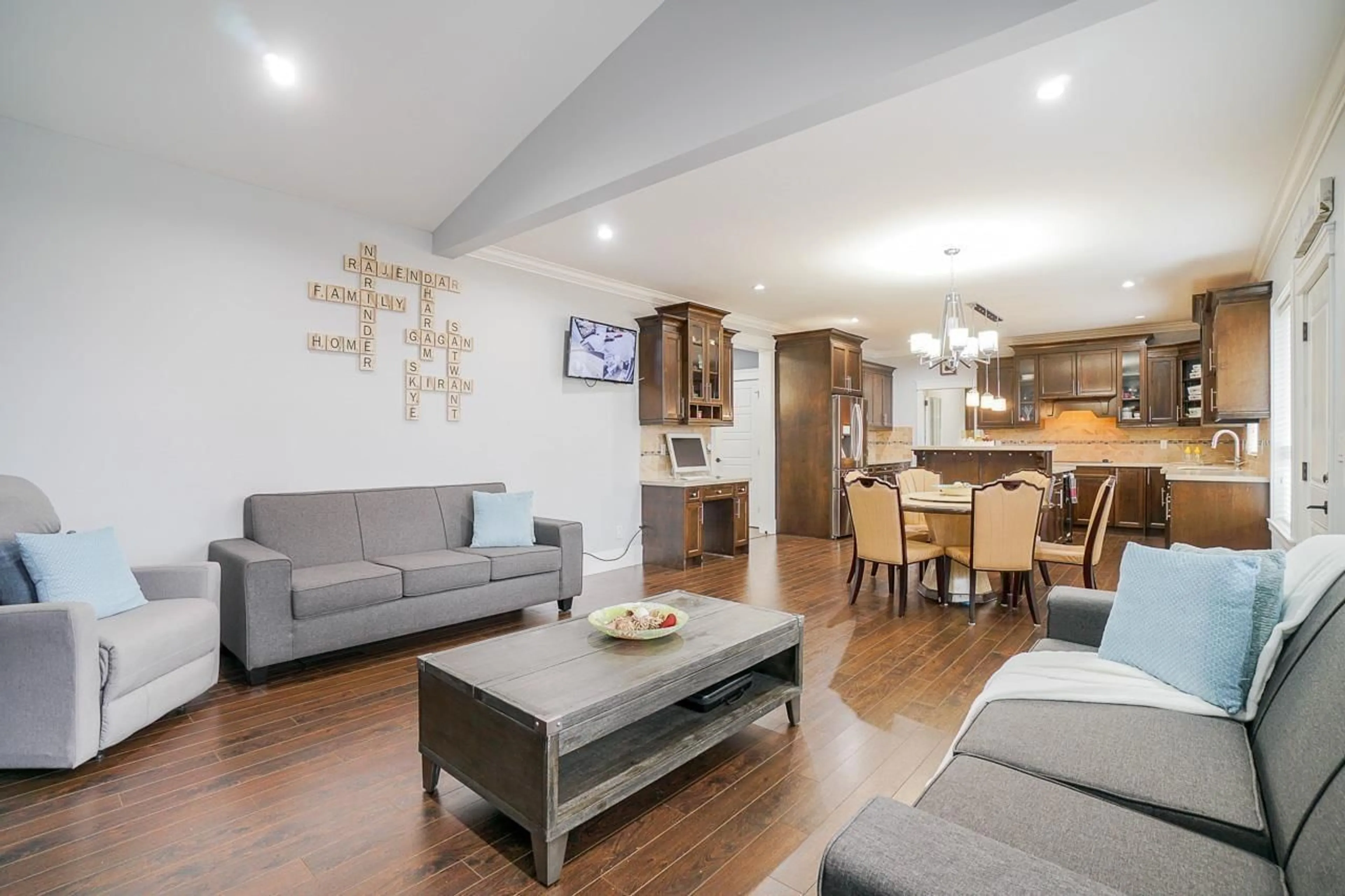 Living room with furniture, wood/laminate floor for 17742 102 AVENUE, Surrey British Columbia V4N5V8