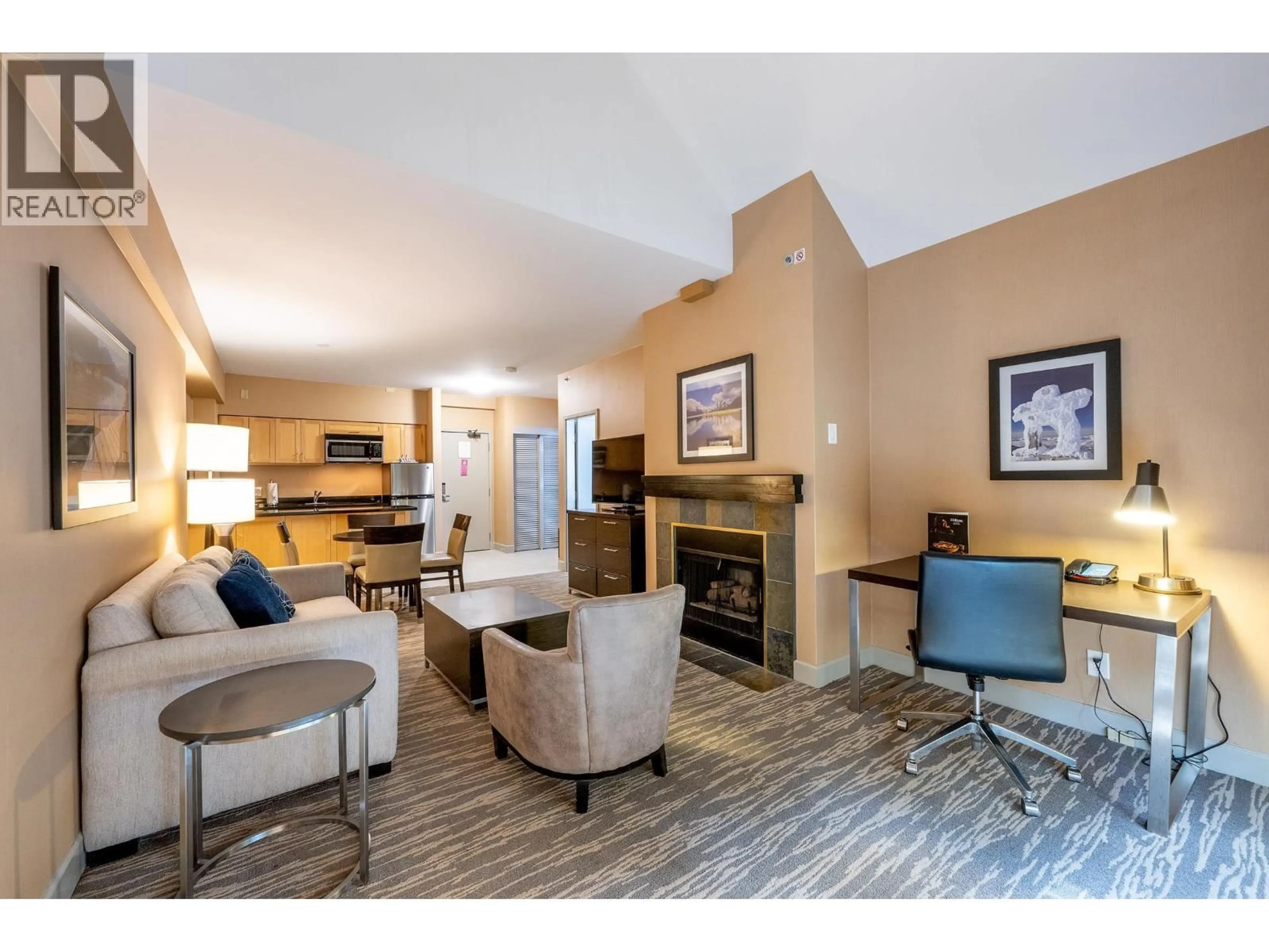 Living room with furniture, wood/laminate floor for 560 - 4050 WHISTLER WAY, Whistler British Columbia V8E1H9