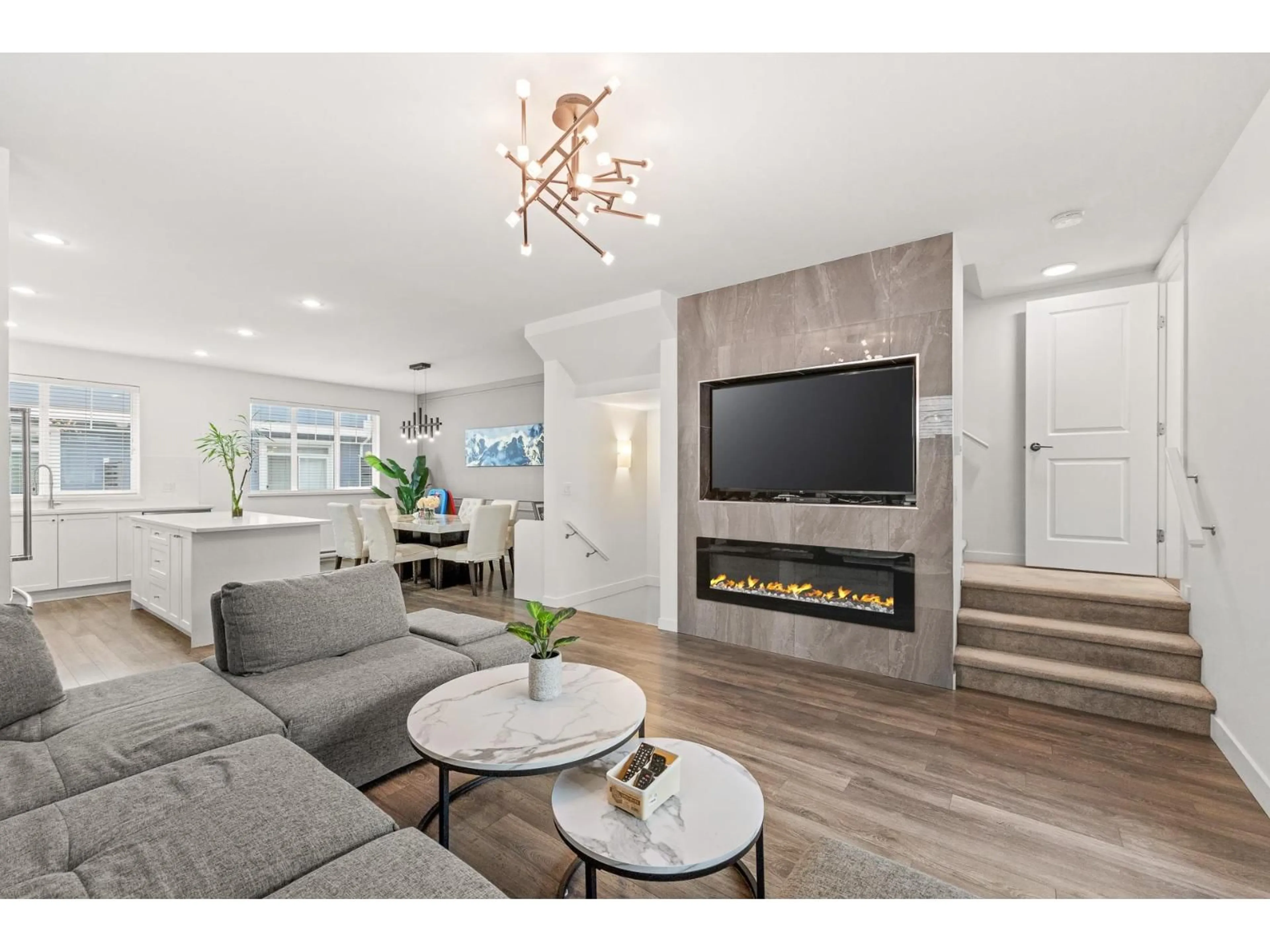 Living room with furniture, wood/laminate floor for 11 - 16323 15 AVENUE, Surrey British Columbia V4A0C5