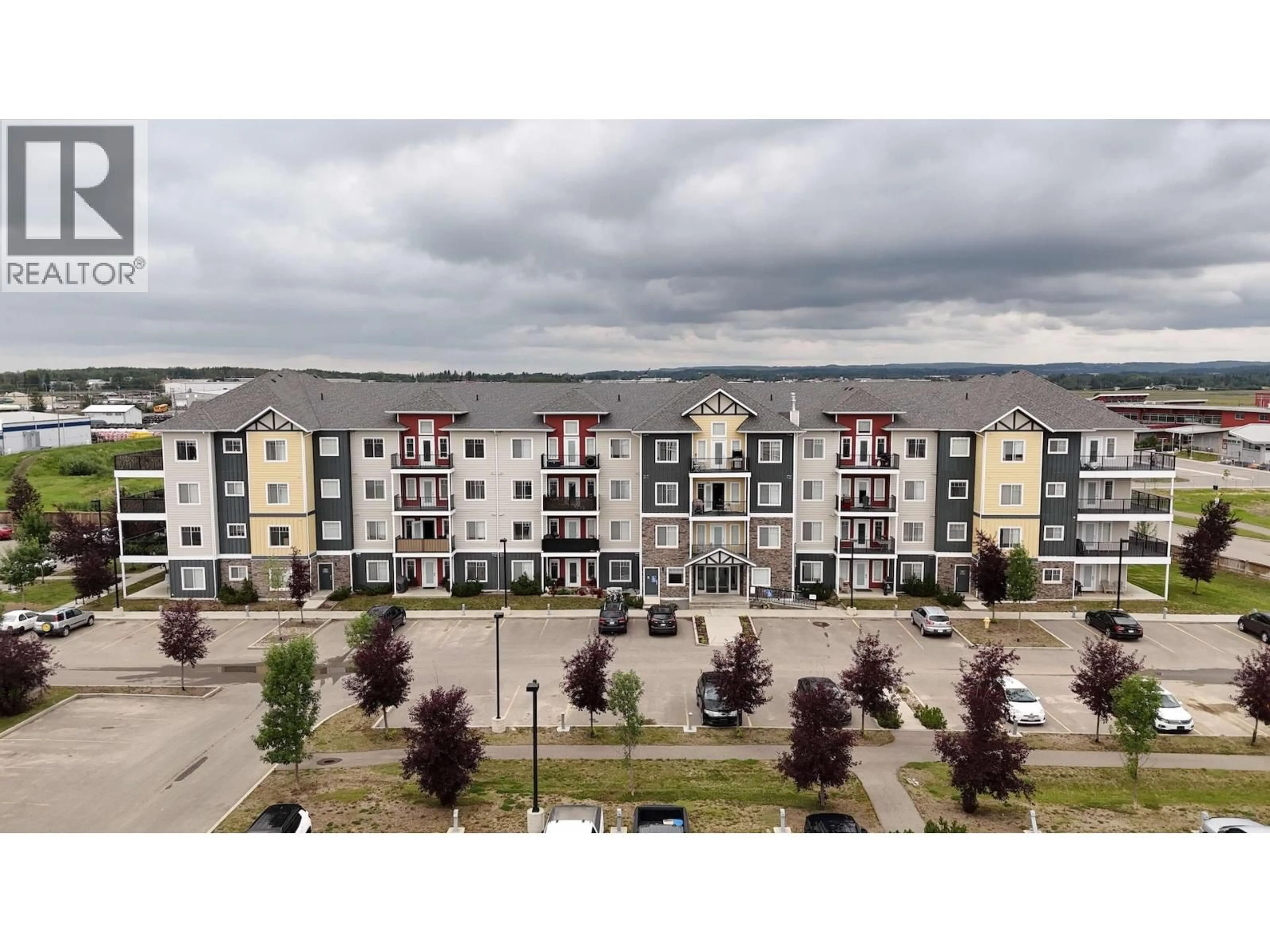 A pic from outside/outdoor area/front of a property/back of a property/a pic from drone, unknown for 106 - 11203 105 AVENUE, Fort St. John British Columbia V1J0L3