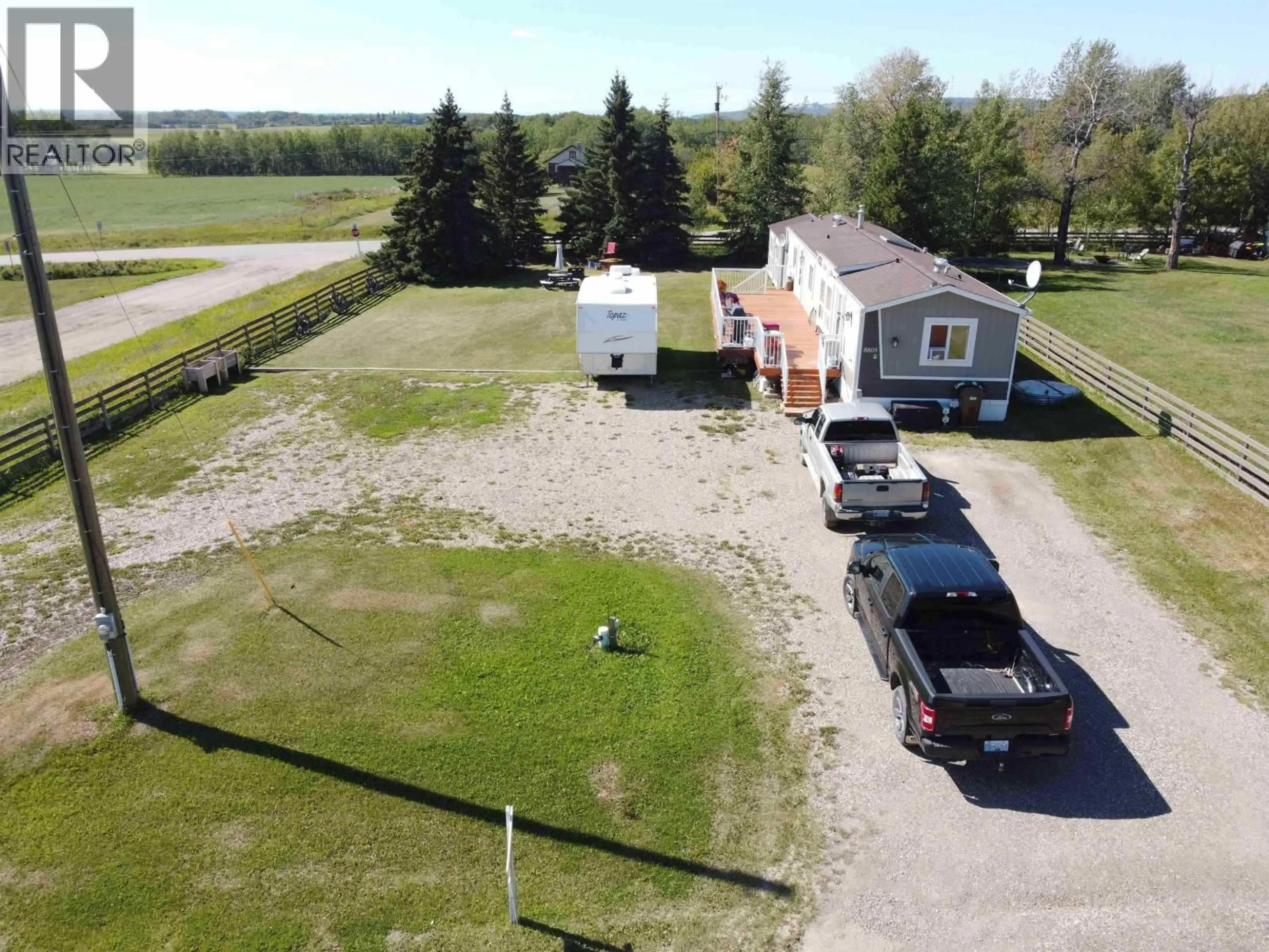 A pic from outside/outdoor area/front of a property/back of a property/a pic from drone, street for 8805 PINE ROAD, Fort St. John British Columbia V1J4M7