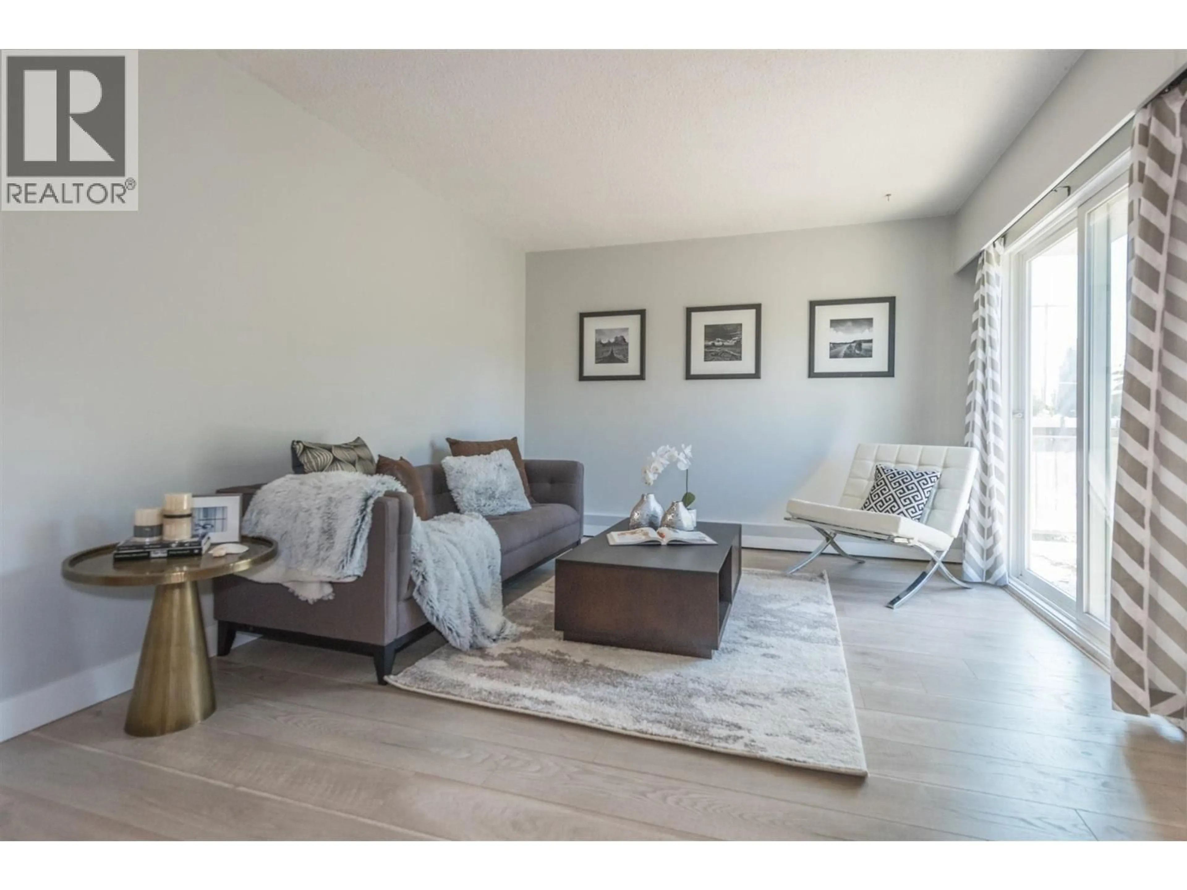 Living room with furniture, wood/laminate floor for 405 - 711 6TH AVENUE, Vancouver British Columbia V5T1L7