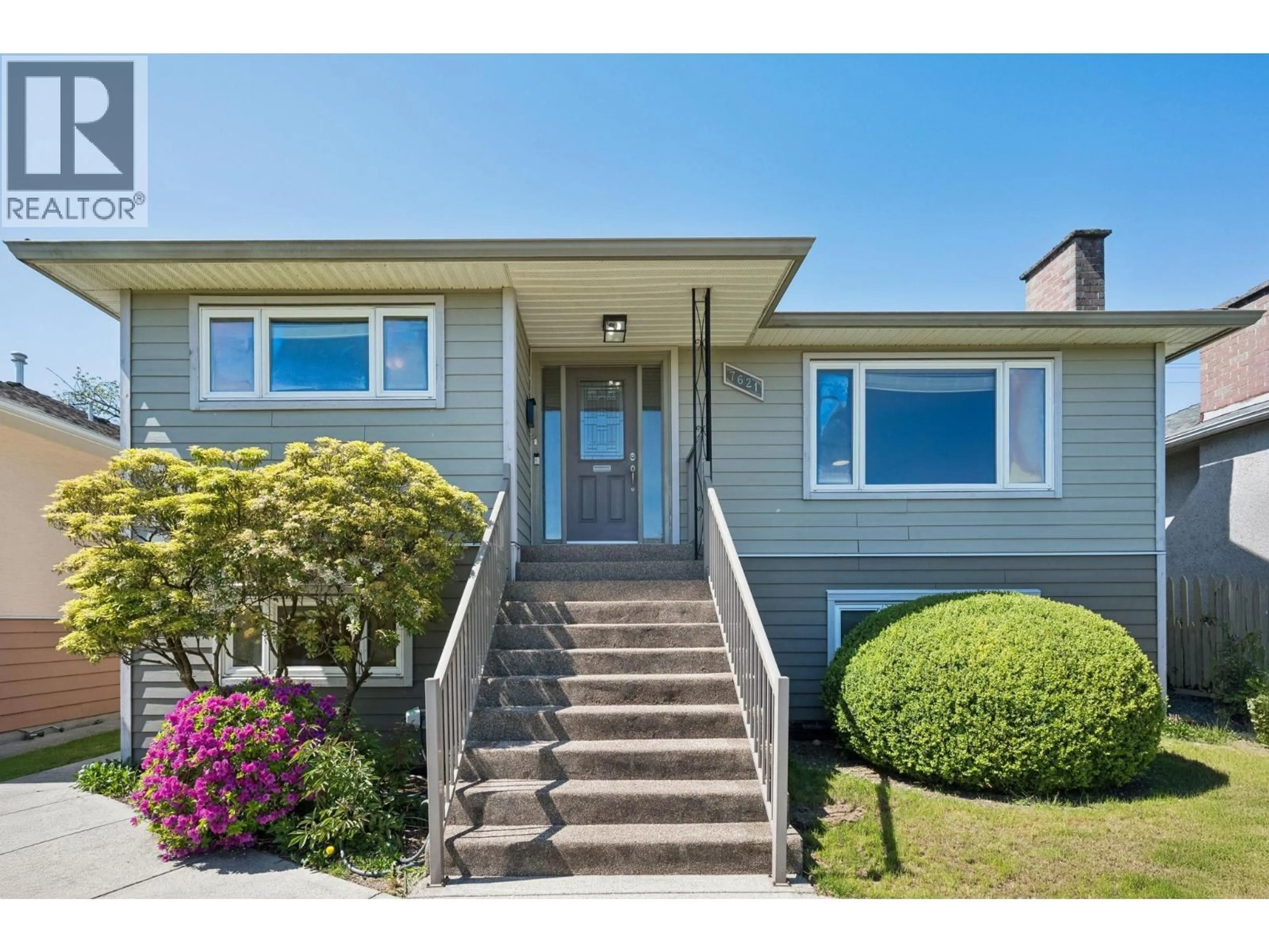 Home with vinyl exterior material, street for 7621 ELLIOTT STREET, Vancouver British Columbia V5S2N8