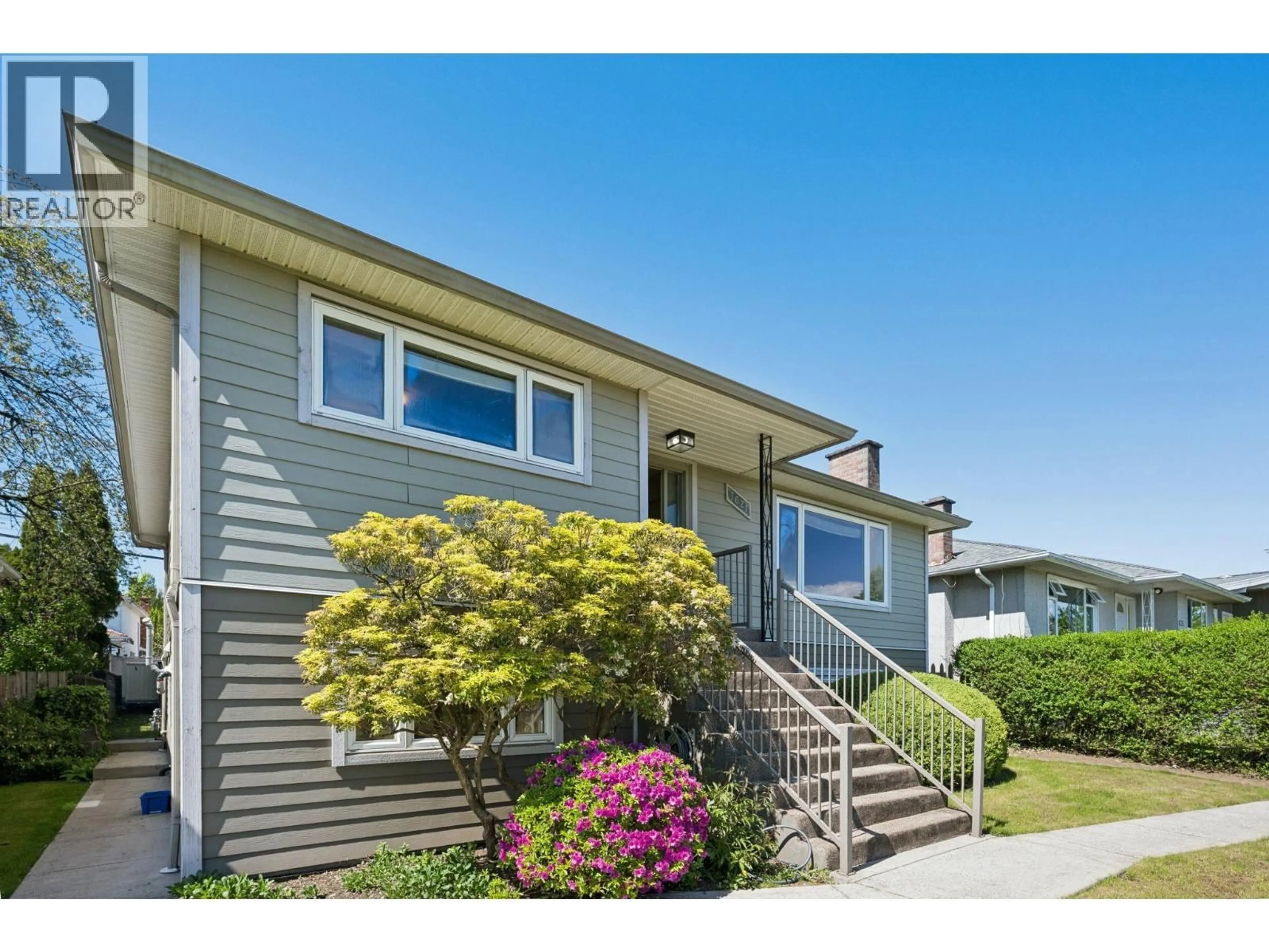 Home with vinyl exterior material, street for 7621 ELLIOTT STREET, Vancouver British Columbia V5S2N8