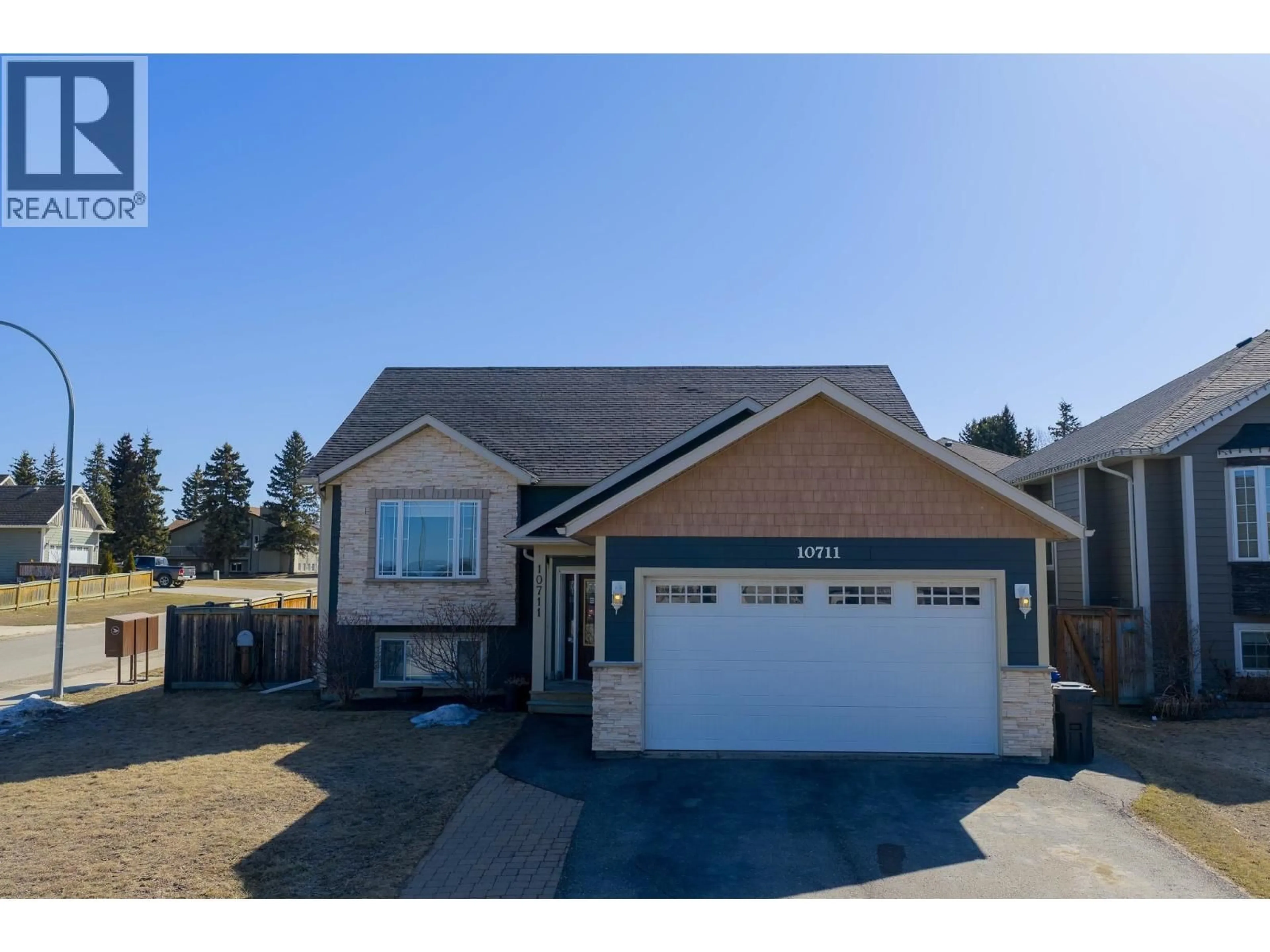 Home with vinyl exterior material, street for 10711 109 STREET, Fort St. John British Columbia V1J0J3