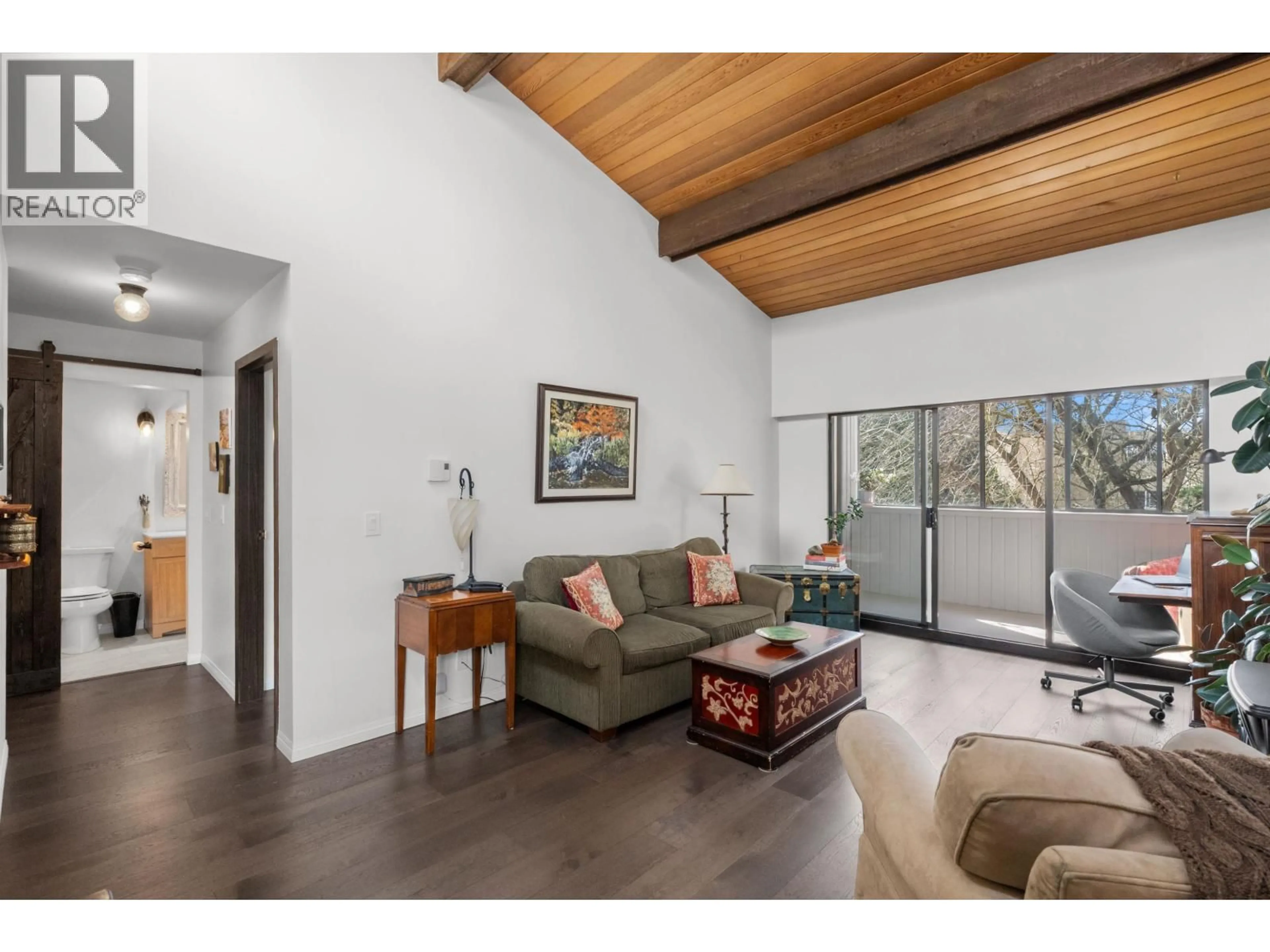 Living room with furniture, wood/laminate floor for 301 - 5553 16 AVENUE, Delta British Columbia V4M2H7
