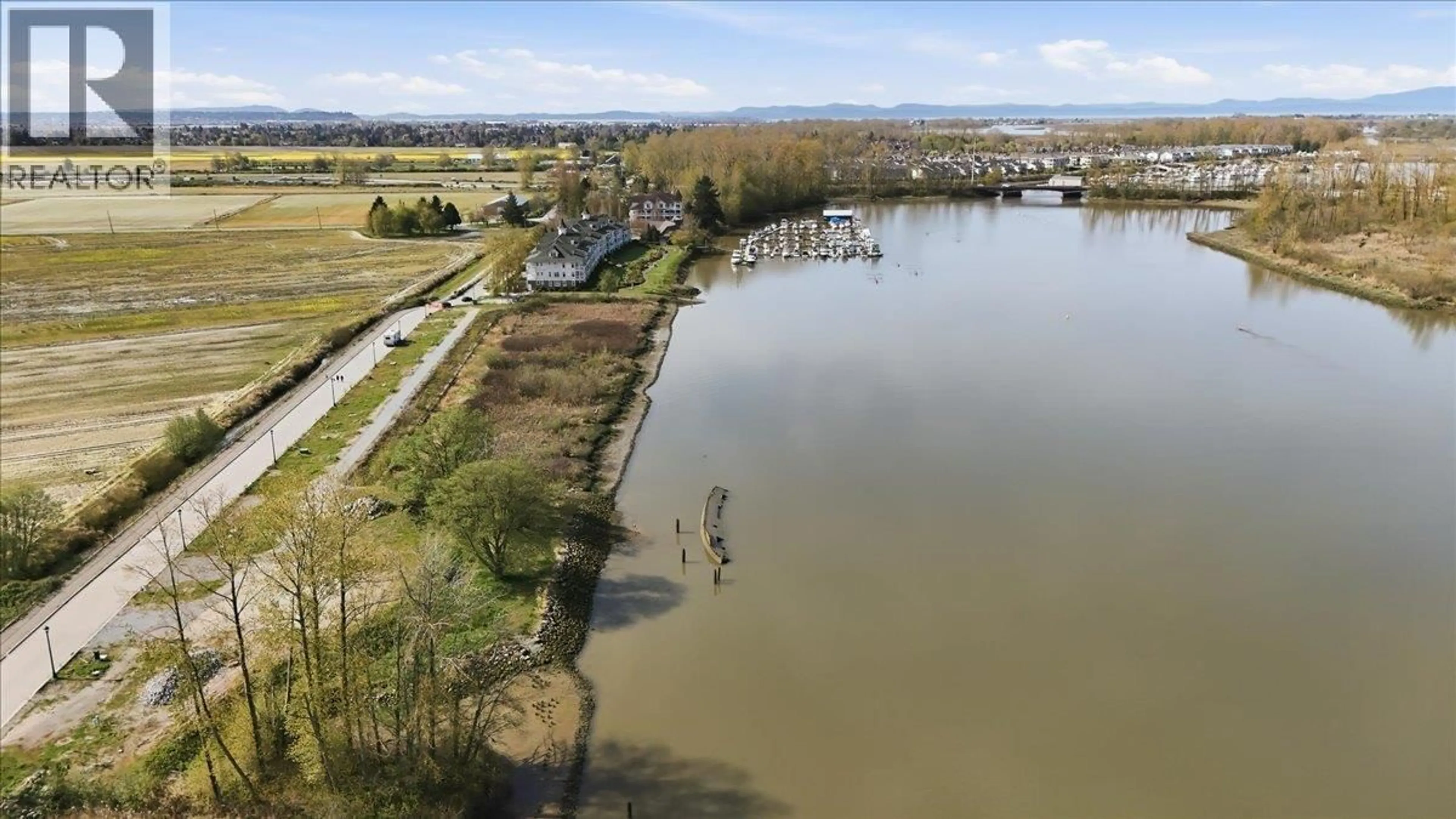 A pic from outside/outdoor area/front of a property/back of a property/a pic from drone, water/lake/river/ocean view for 6345 RIVER ROAD, Delta British Columbia V4K5E3