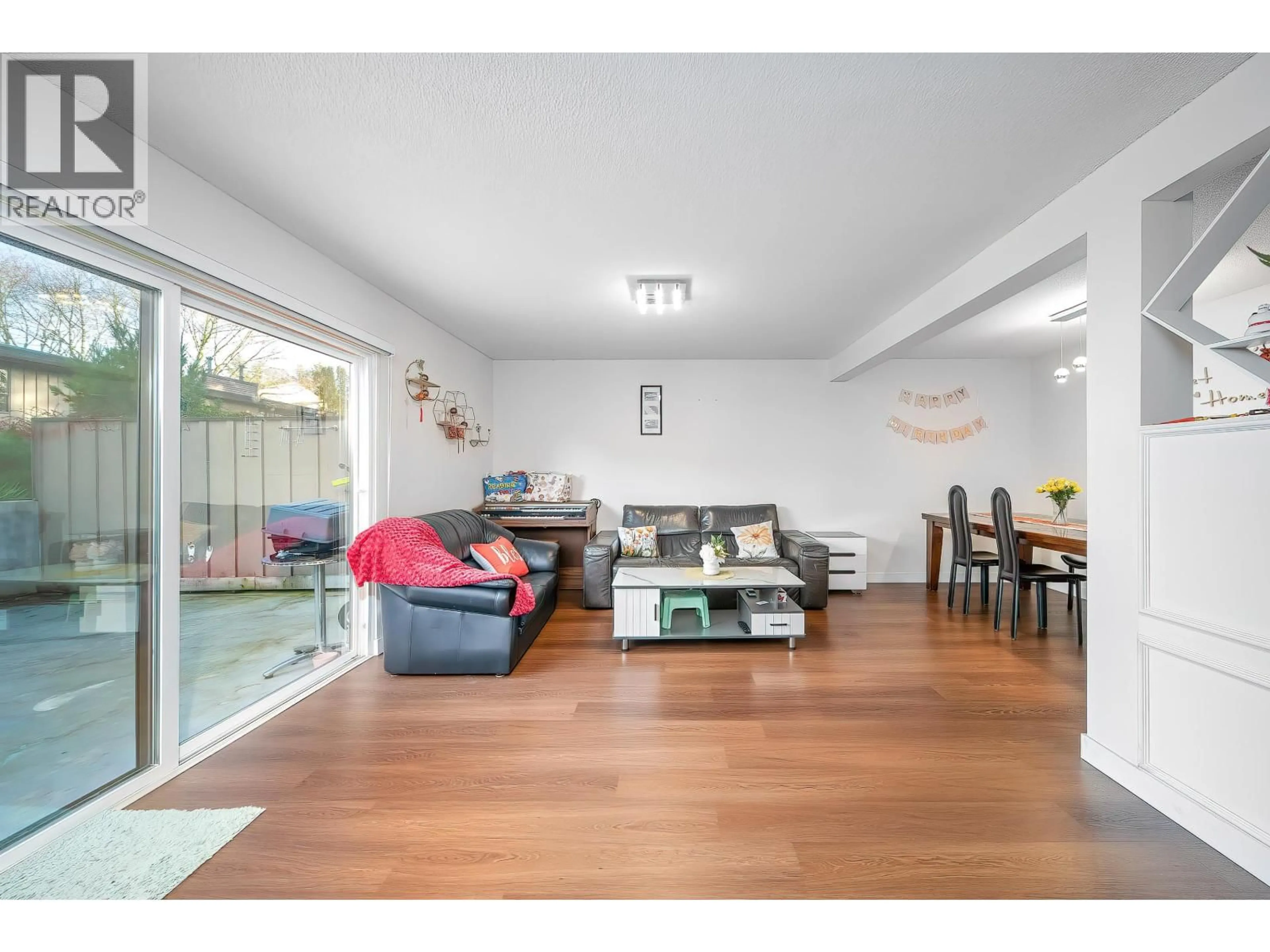 Living room with furniture, wood/laminate floor for 72 - 3180 58TH AVENUE, Vancouver British Columbia V5S3S8