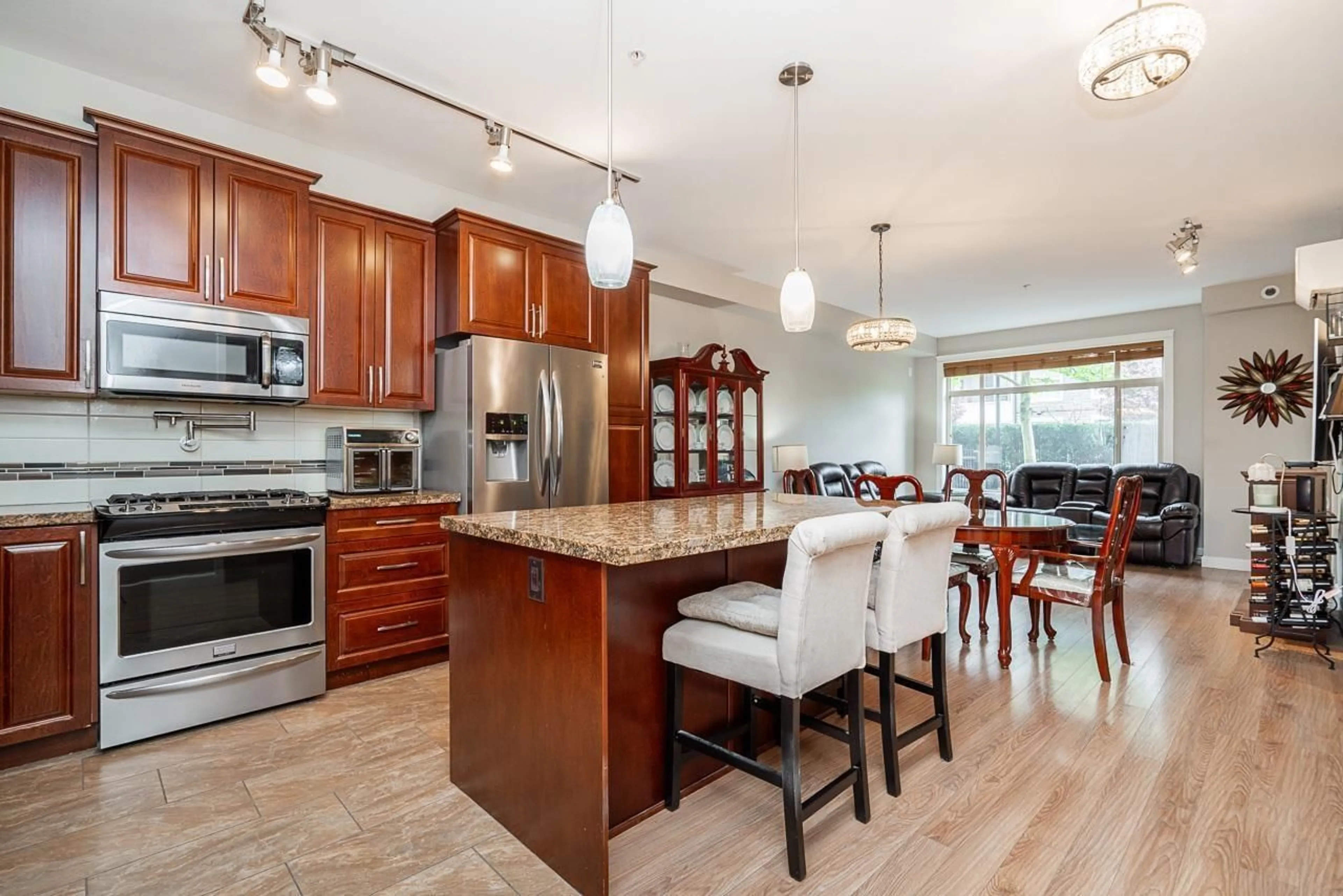 Open concept kitchen, wood/laminate floor for 105 - 8157 207 STREET, Langley British Columbia V2Y0V4