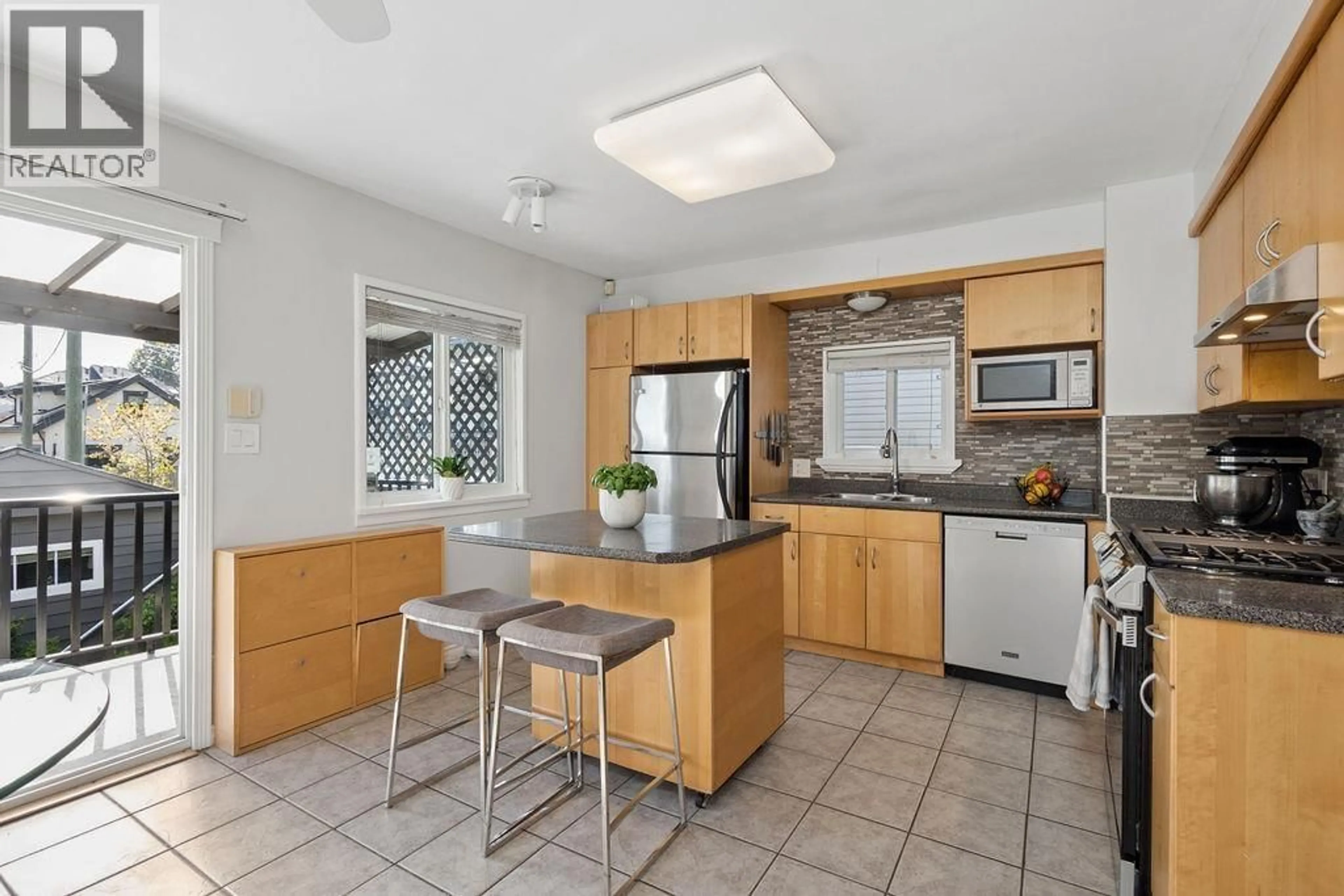 Standard kitchen, ceramic/tile floor for 4344 SKEENA STREET, Vancouver British Columbia V5R2L7