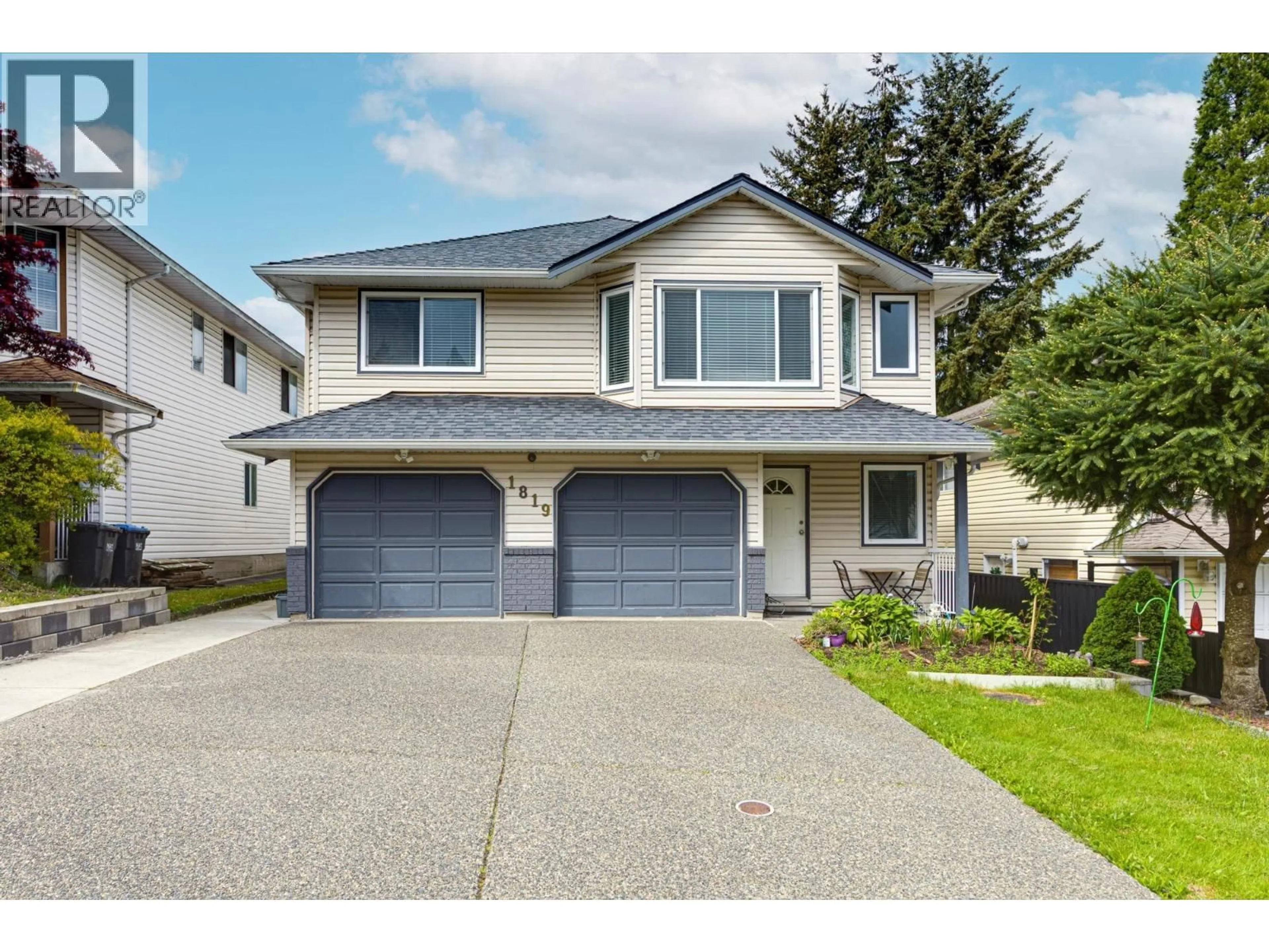 Home with vinyl exterior material, street for 1819 JACANA AVENUE, Port Coquitlam British Columbia V3C5C4