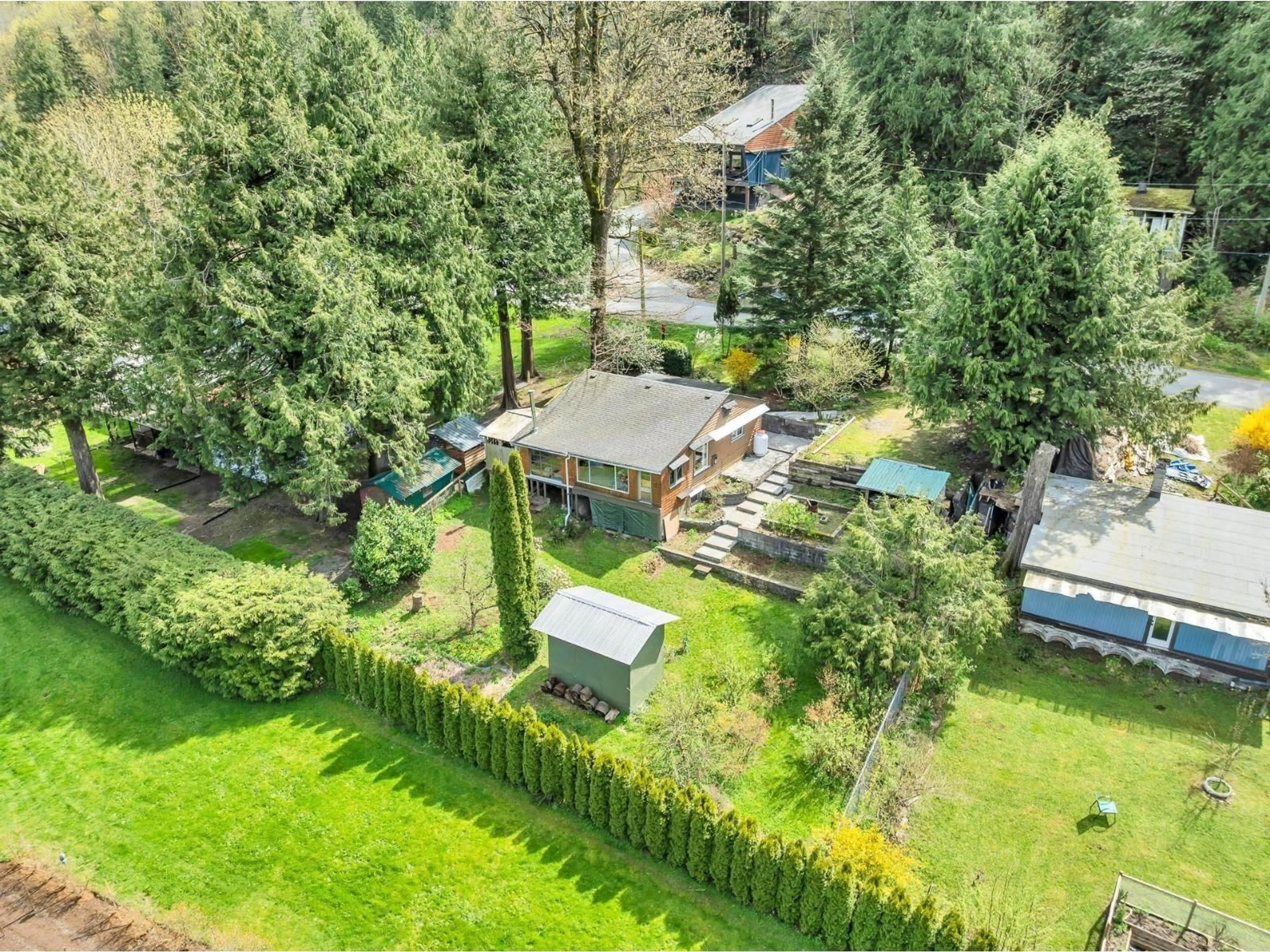 A pic from outside/outdoor area/front of a property/back of a property/a pic from drone, forest/trees view for 44239 BAYVIEW ROAD, Mission British Columbia V0M1N0