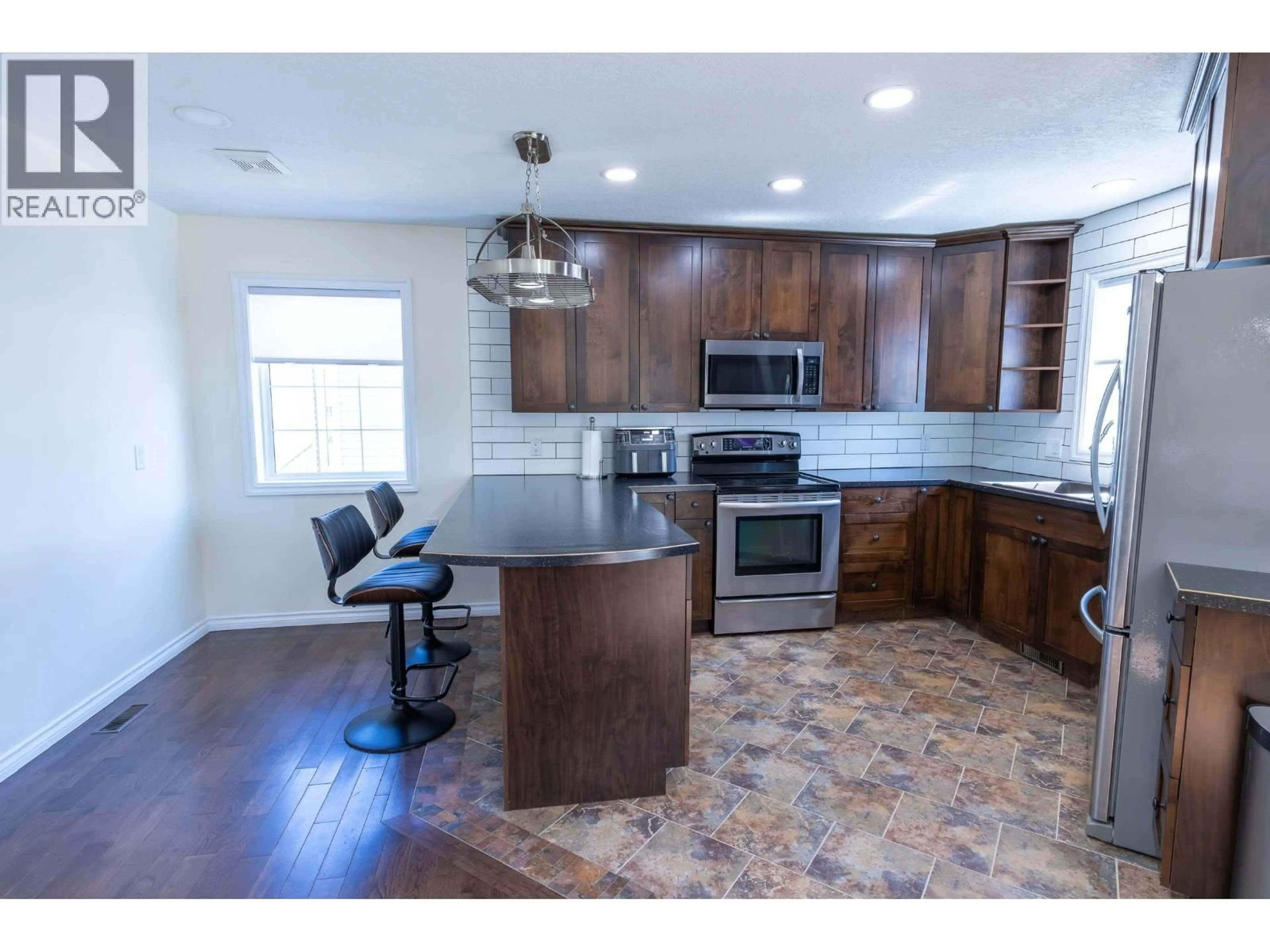 Open concept kitchen, ceramic/tile floor for 9019 111 AVENUE, Fort St. John British Columbia V1J6Z2