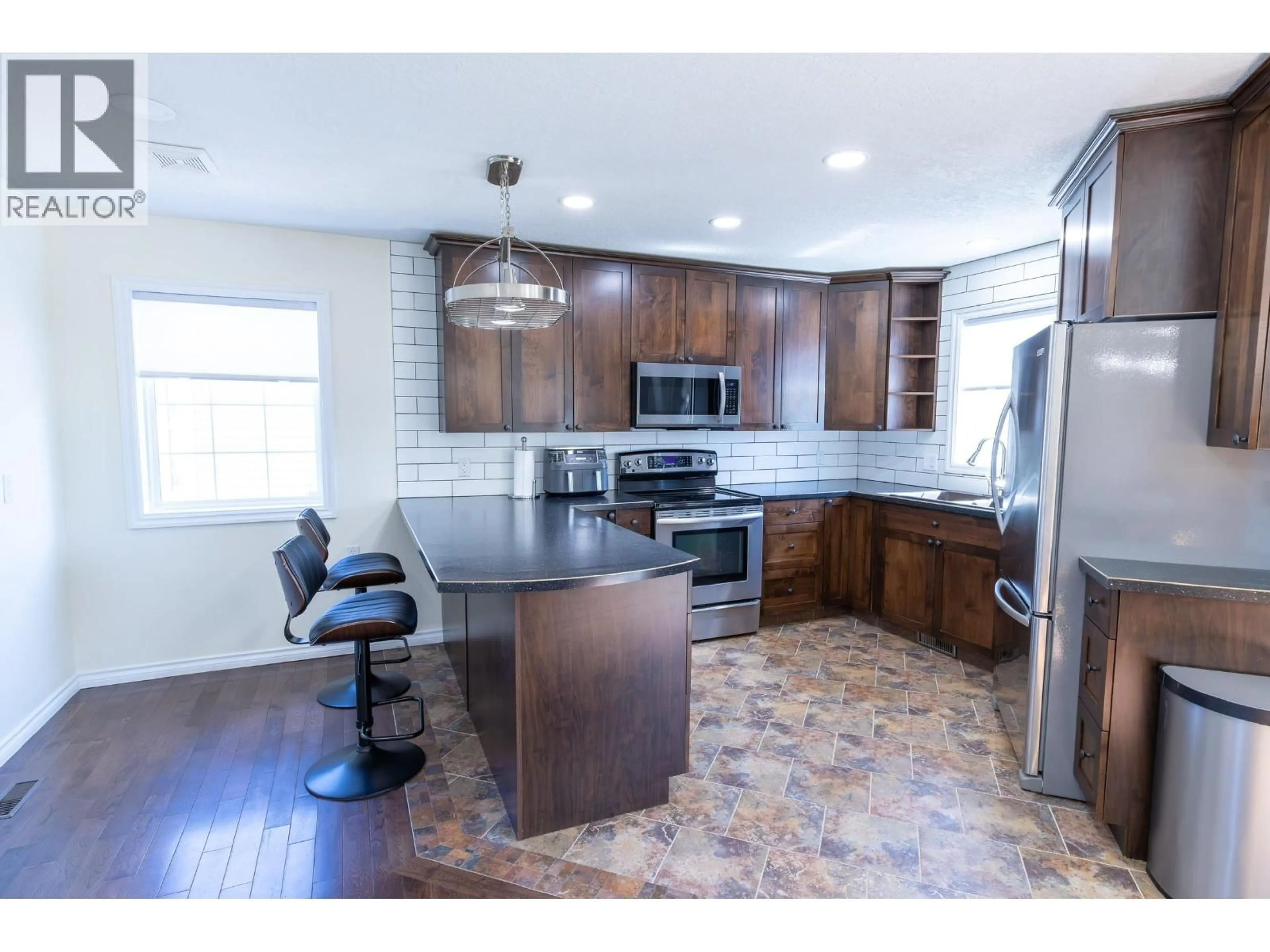 Open concept kitchen, unknown for 9019 111 AVENUE, Fort St. John British Columbia V1J6Z2