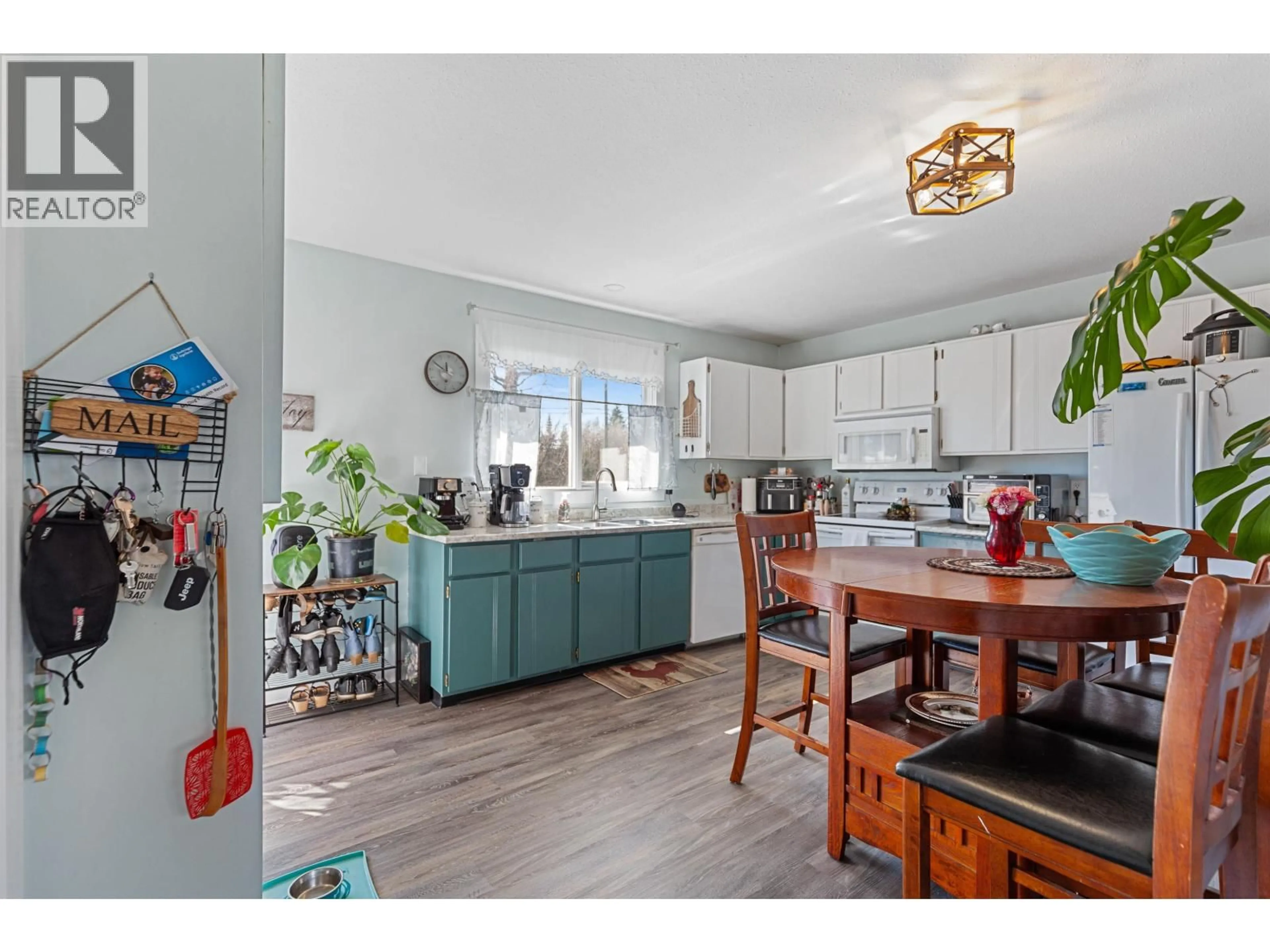 Open concept kitchen, wood/laminate floor for 6485 DRIFTWOOD ROAD, Prince George British Columbia V2K4E3