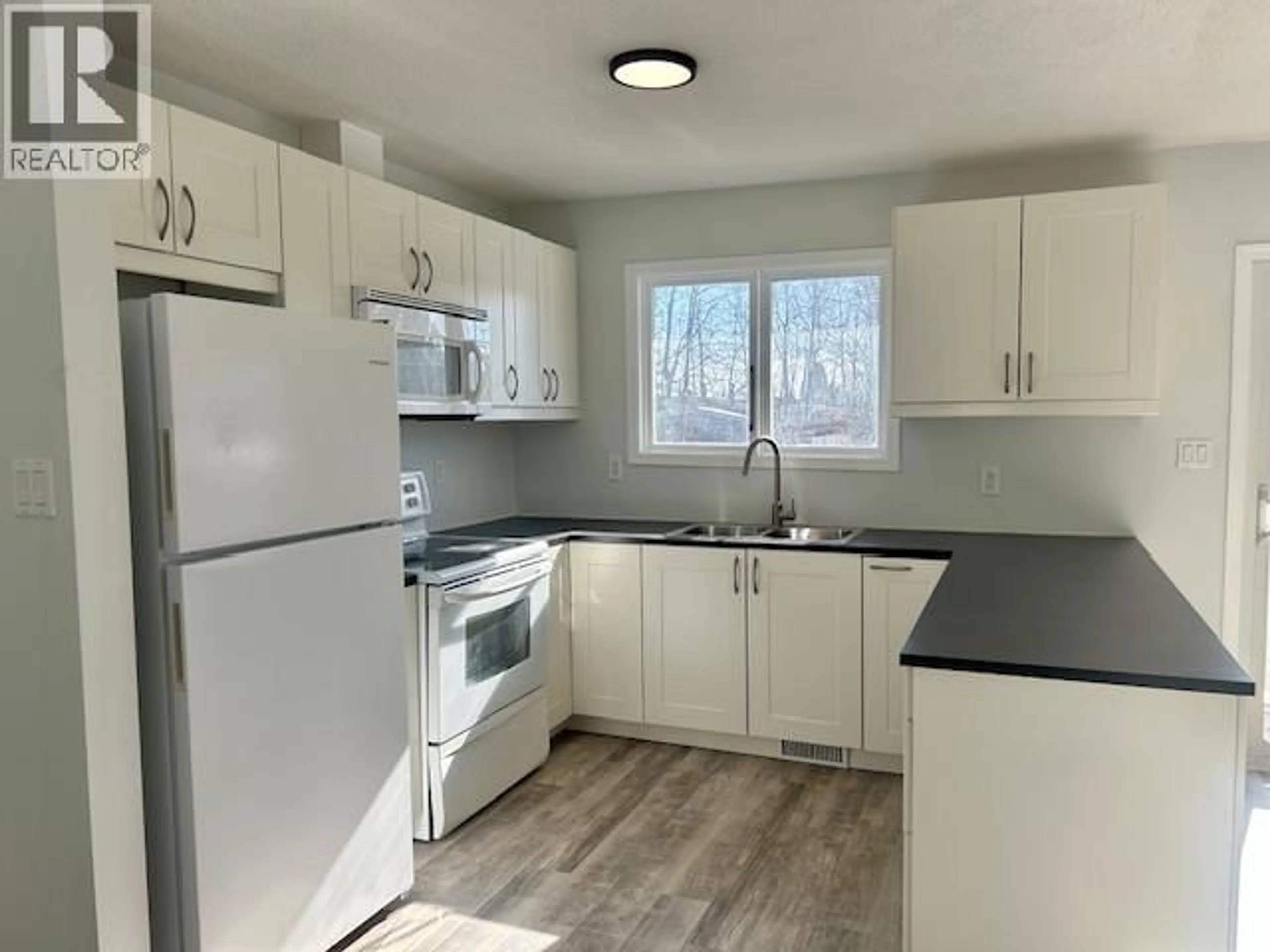 Standard kitchen, wood/laminate floor for 4720 BOUNDARY ROAD, Fort Nelson British Columbia V0C1R0