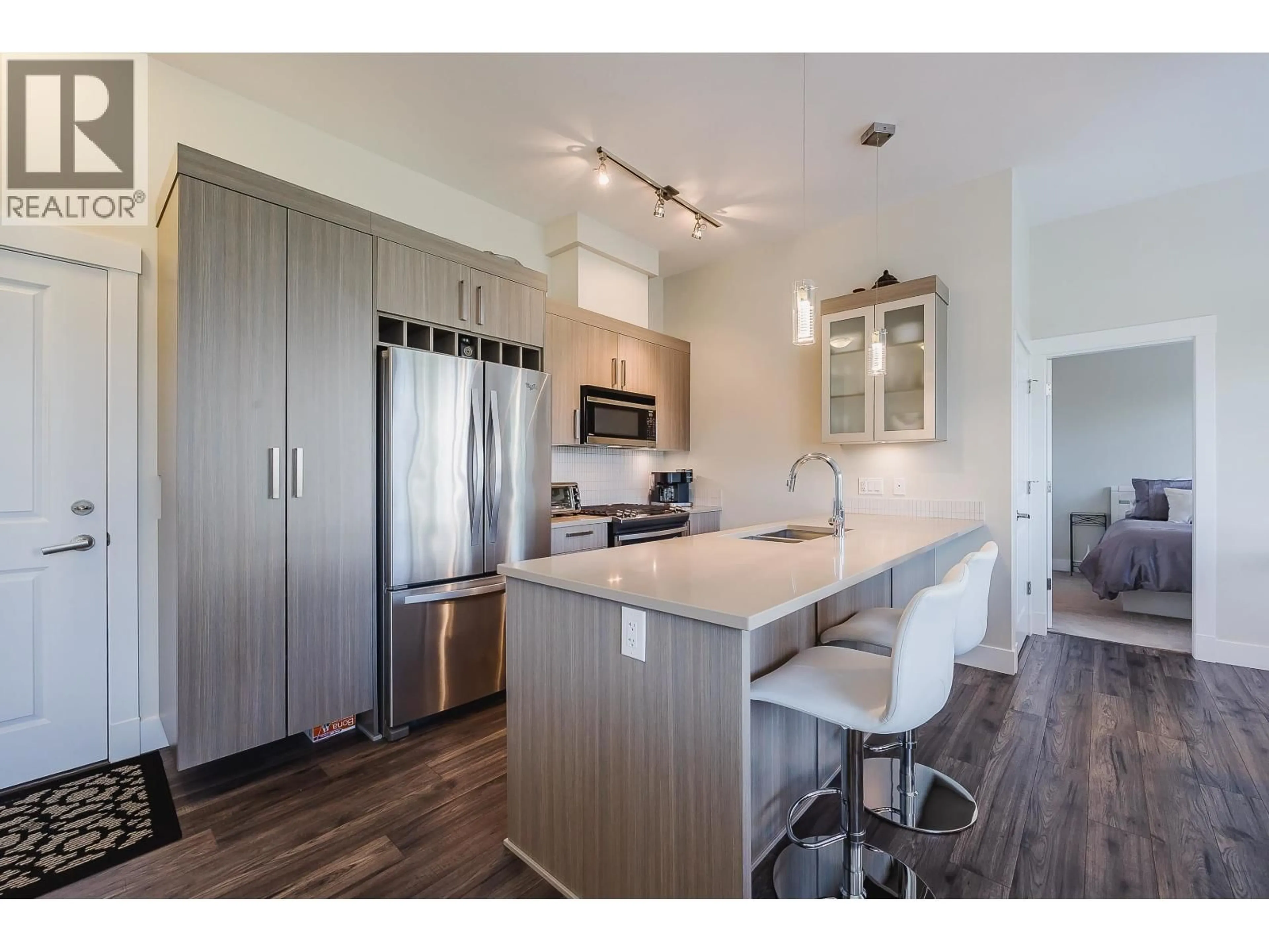 Open concept kitchen, wood/laminate floor for 409 - 22327 RIVER ROAD, Maple Ridge British Columbia V2X2C7