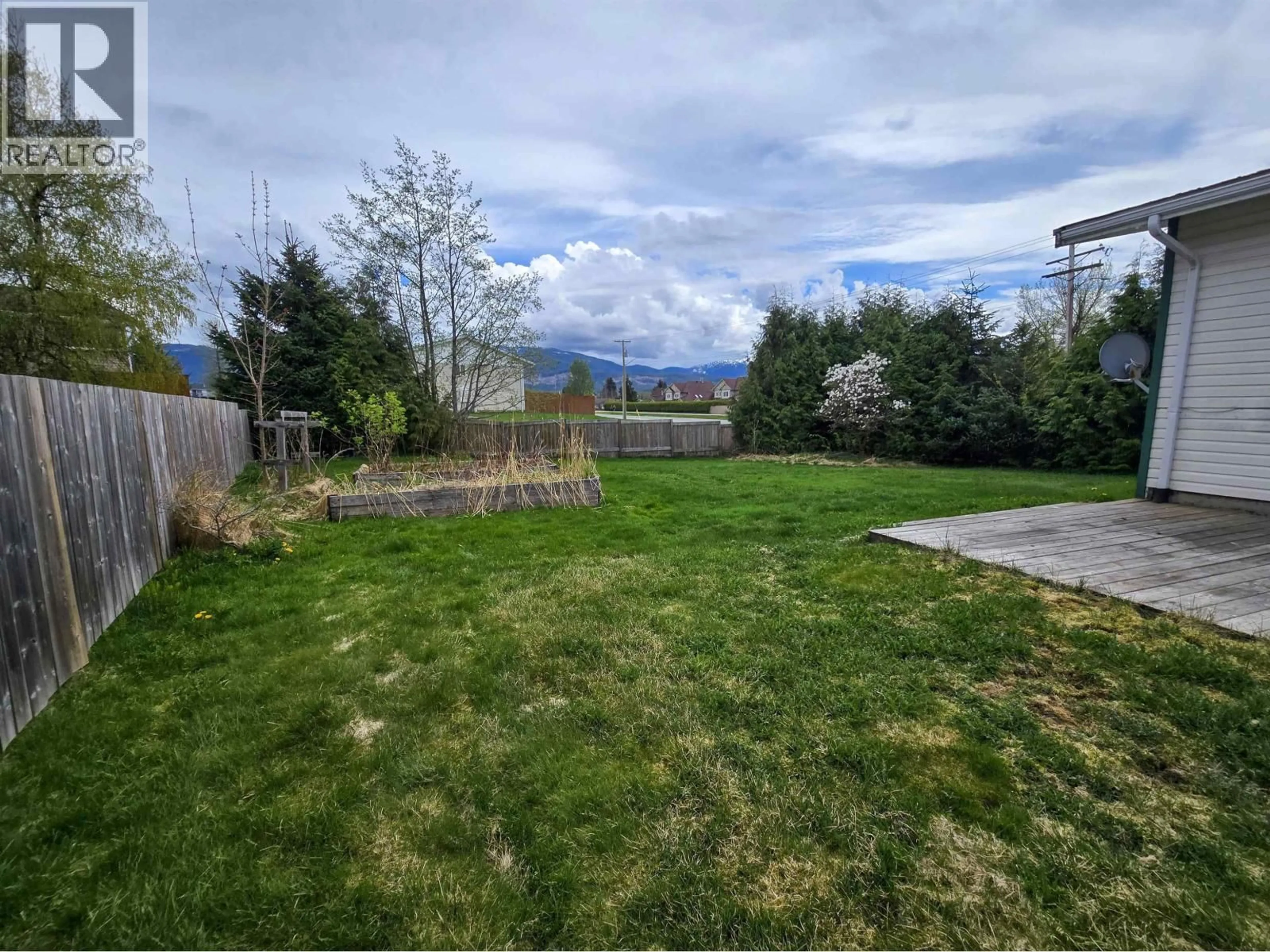 A pic from outside/outdoor area/front of a property/back of a property/a pic from drone, mountain view for 1 CARSWELL STREET, Kitimat British Columbia V8C1B2