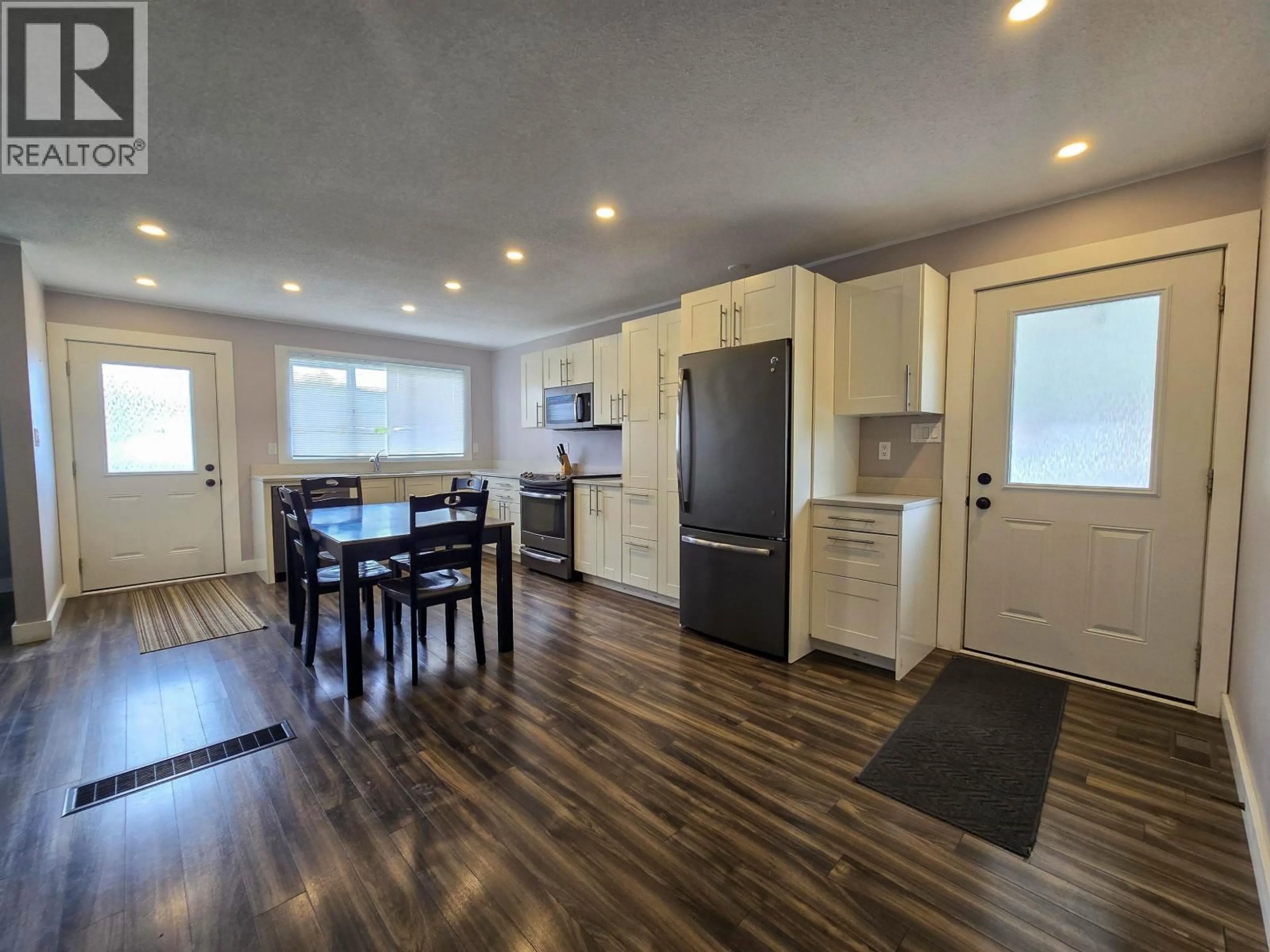 Open concept kitchen, wood/laminate floor for 1 CARSWELL STREET, Kitimat British Columbia V8C1B2