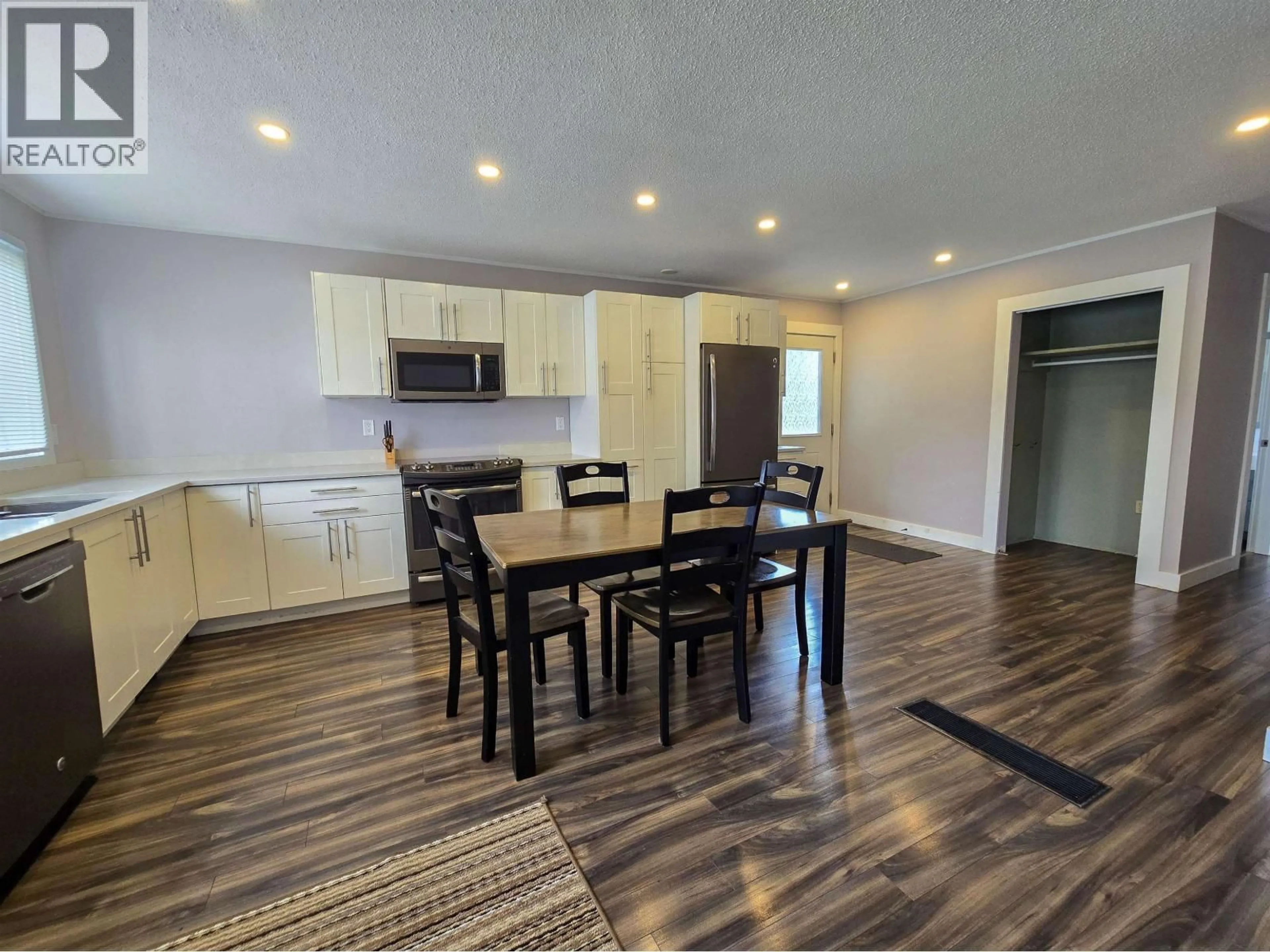 Open concept kitchen, wood/laminate floor for 1 CARSWELL STREET, Kitimat British Columbia V8C1B2