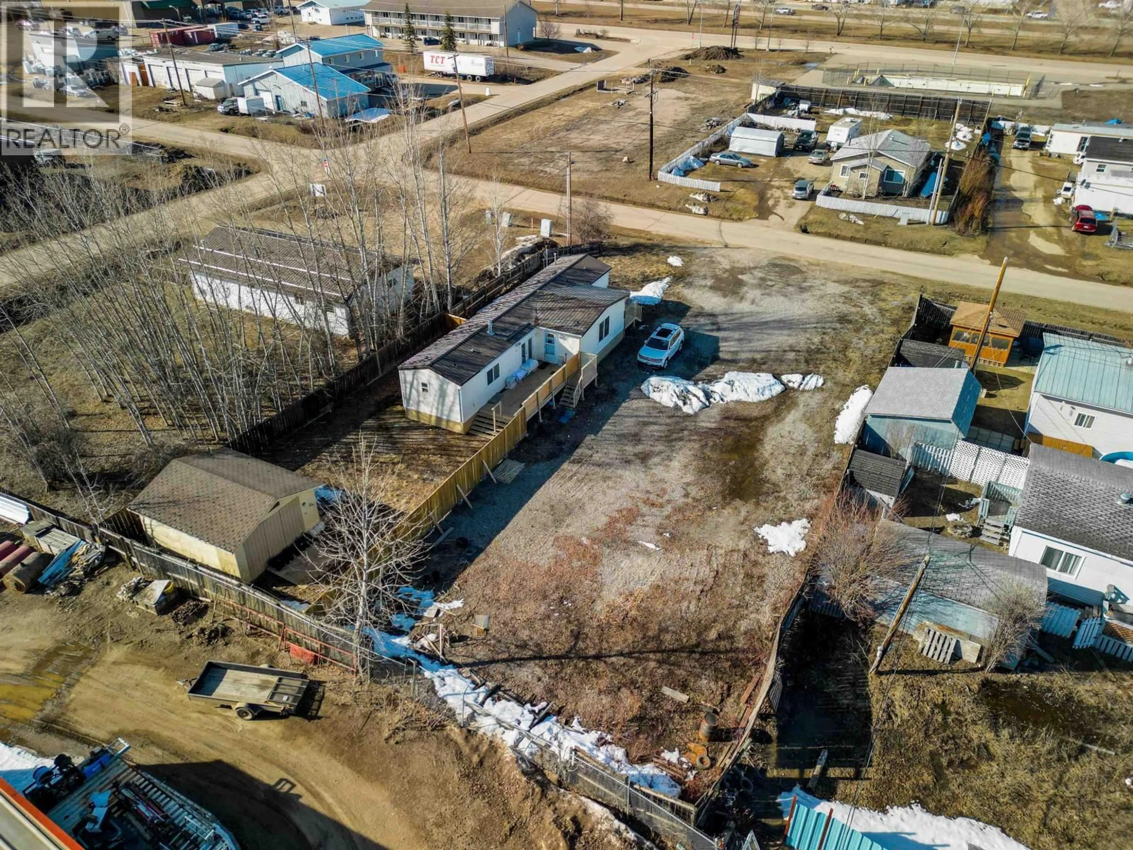 A pic from outside/outdoor area/front of a property/back of a property/a pic from drone, building for 4707 49 AVENUE, Fort Nelson British Columbia V0C1R0