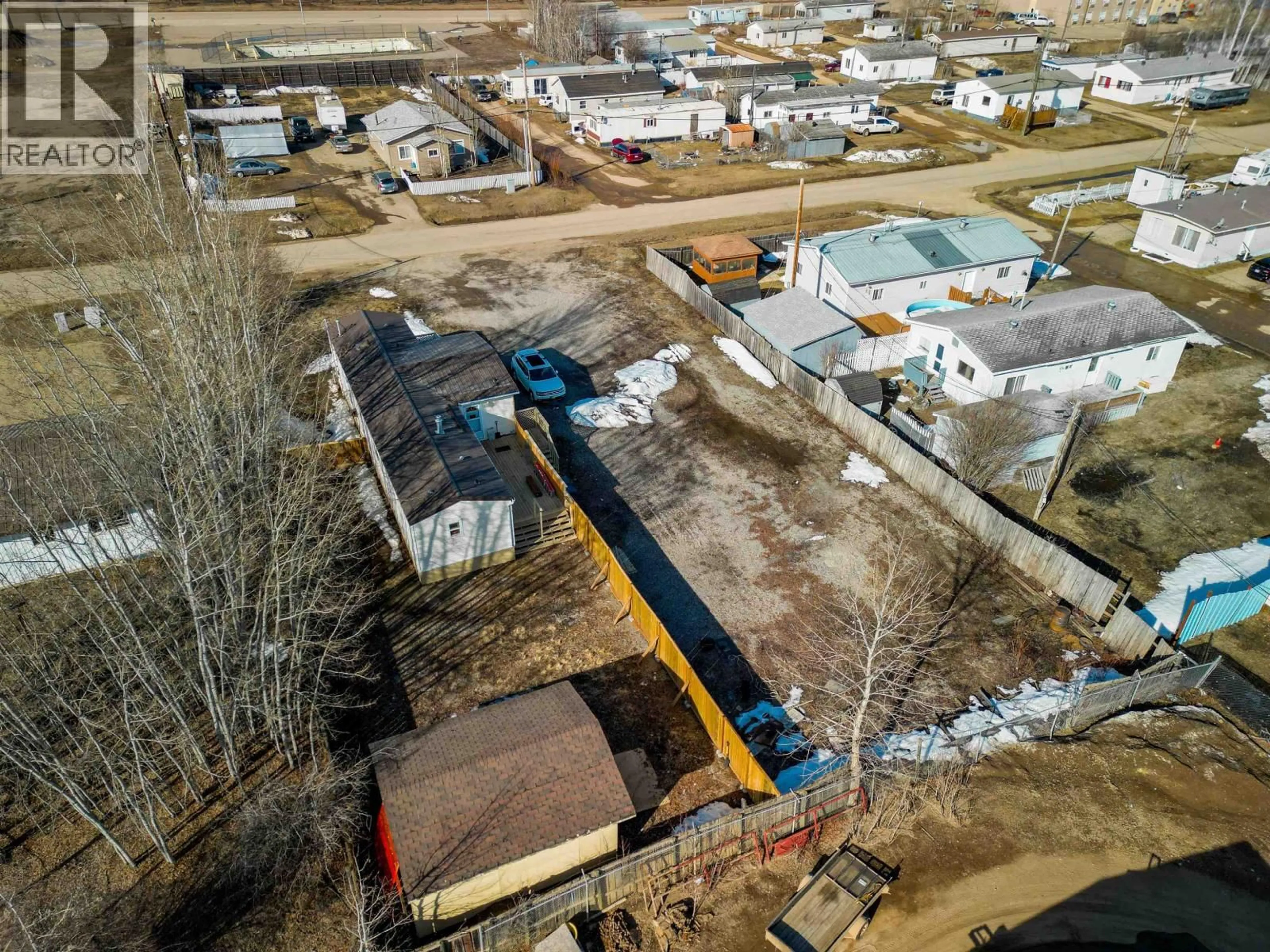 A pic from outside/outdoor area/front of a property/back of a property/a pic from drone, street for 4707 49 AVENUE, Fort Nelson British Columbia V0C1R0