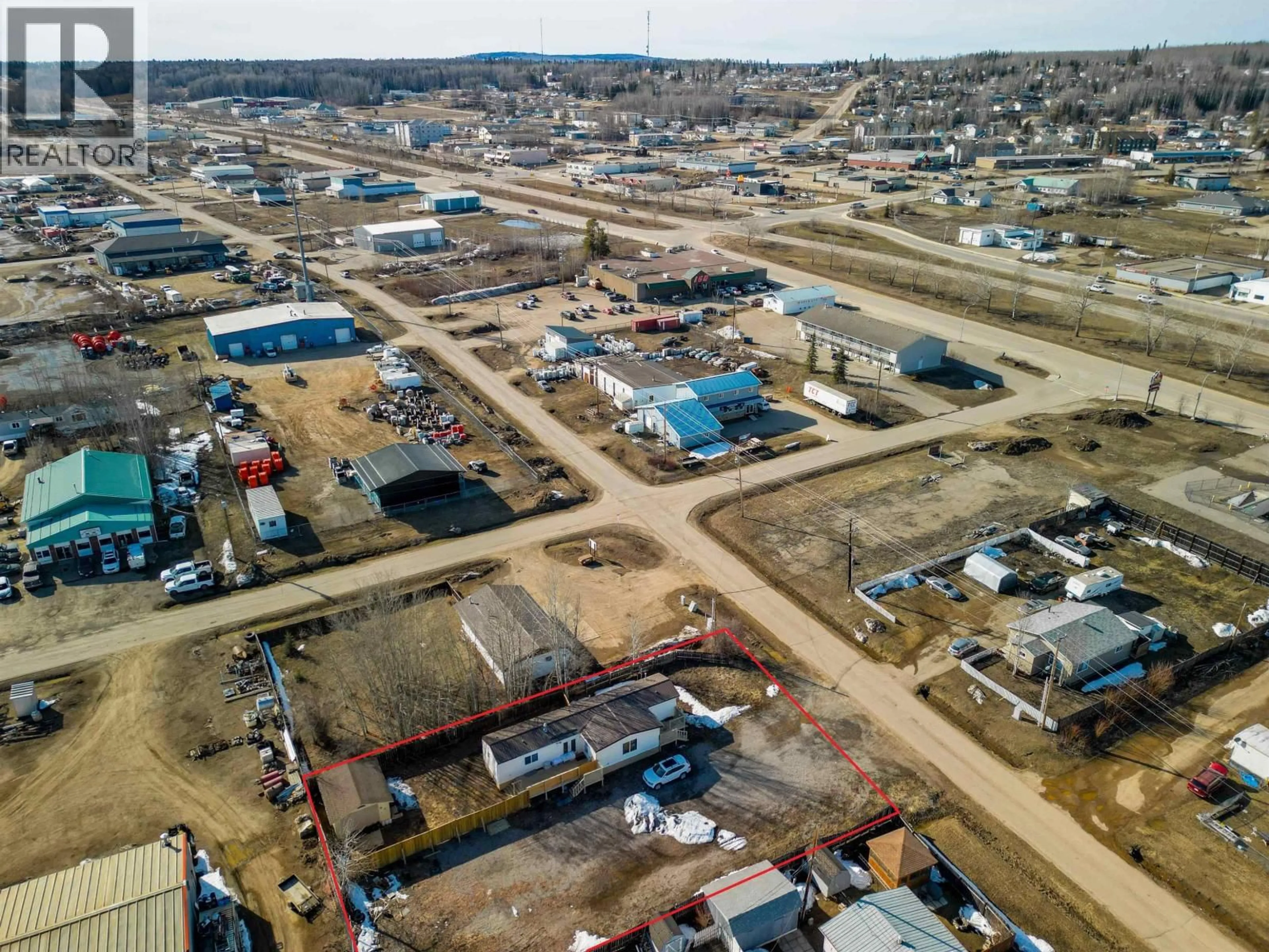 A pic from outside/outdoor area/front of a property/back of a property/a pic from drone, street for 4707 49 AVENUE, Fort Nelson British Columbia V0C1R0
