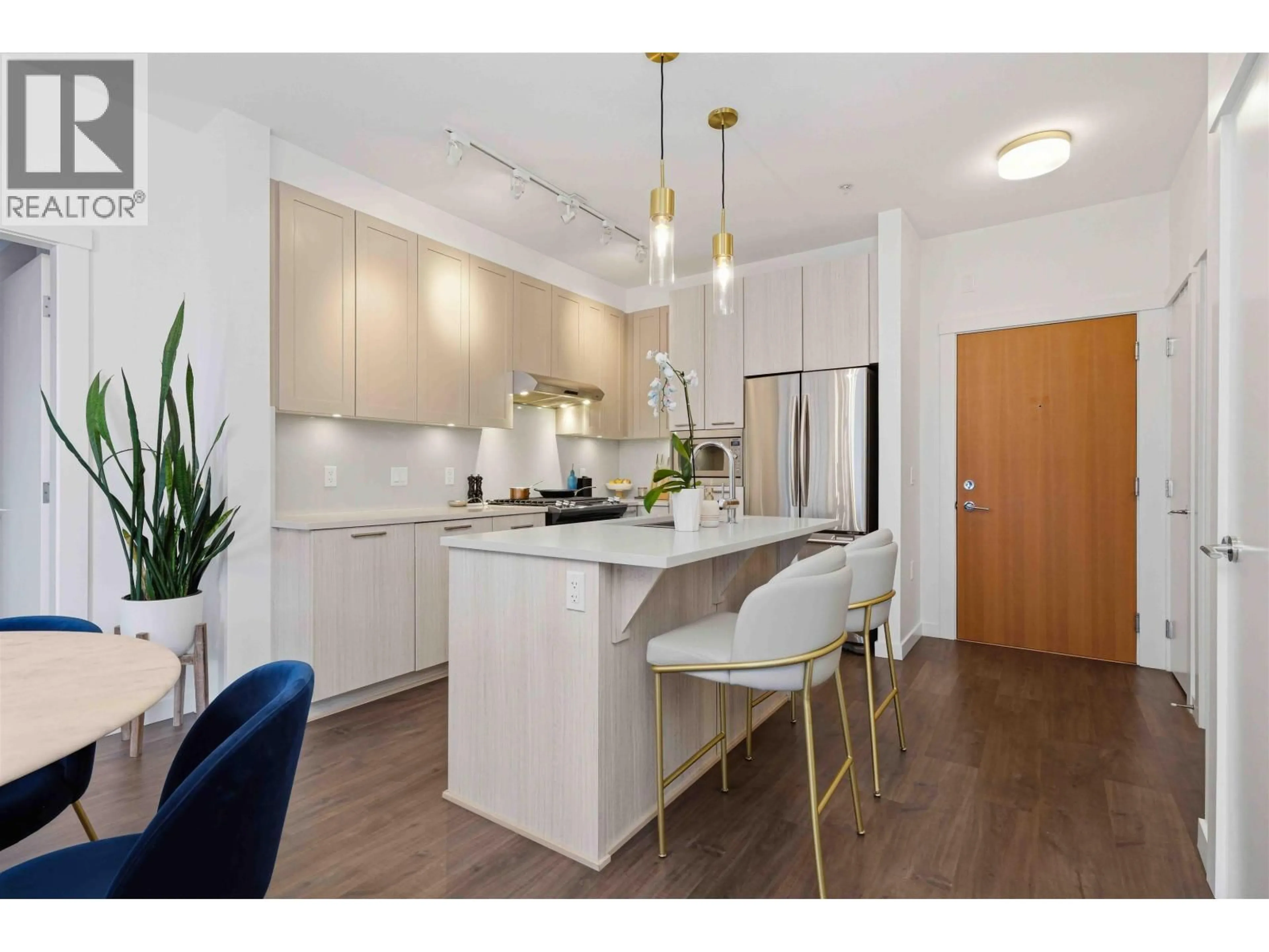 Open concept kitchen, wood/laminate floor for 409 - 123 1ST STREET, North Vancouver British Columbia V7M0E5