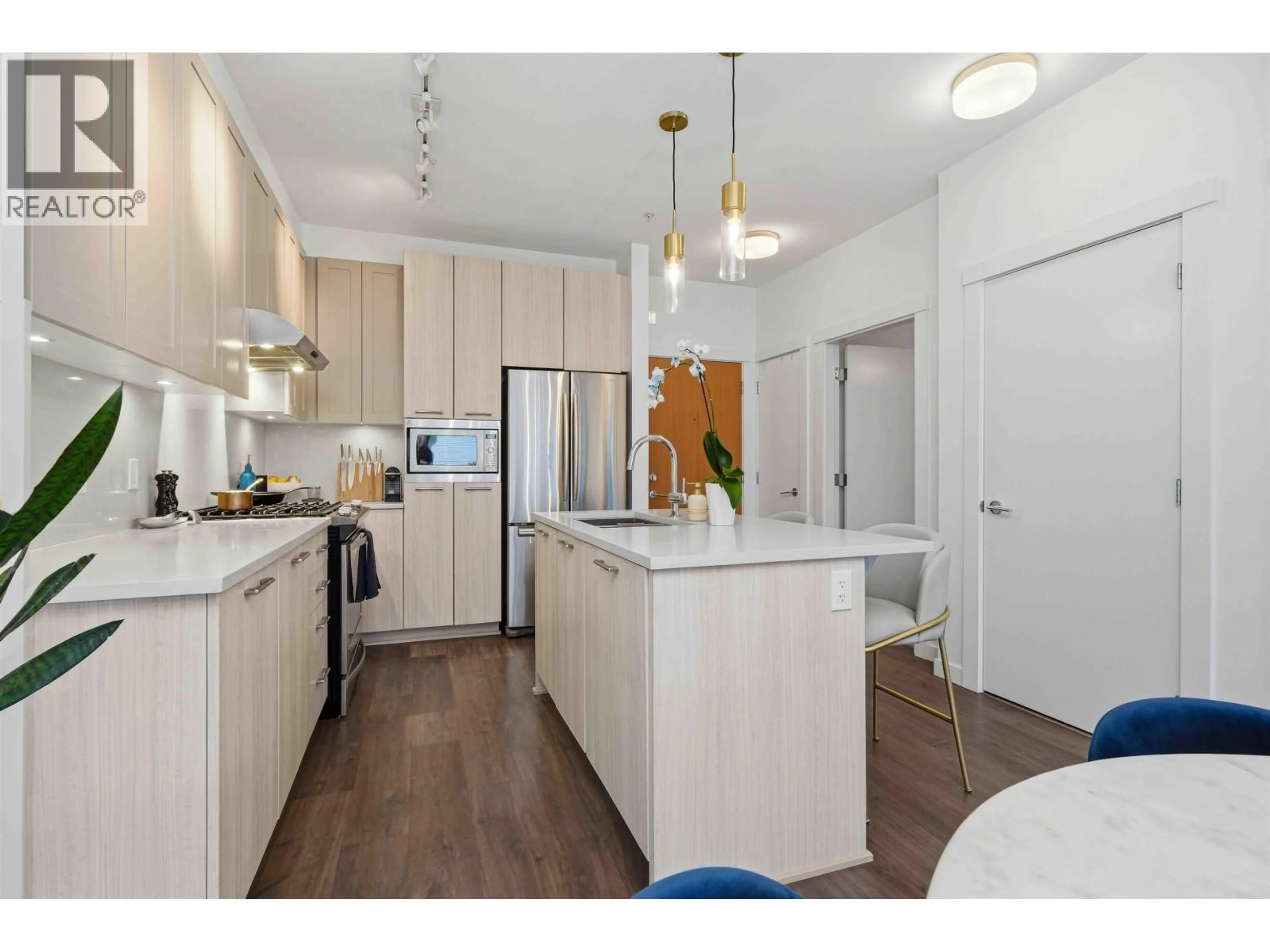 Open concept kitchen, wood/laminate floor for 409 - 123 1ST STREET, North Vancouver British Columbia V7M0E5